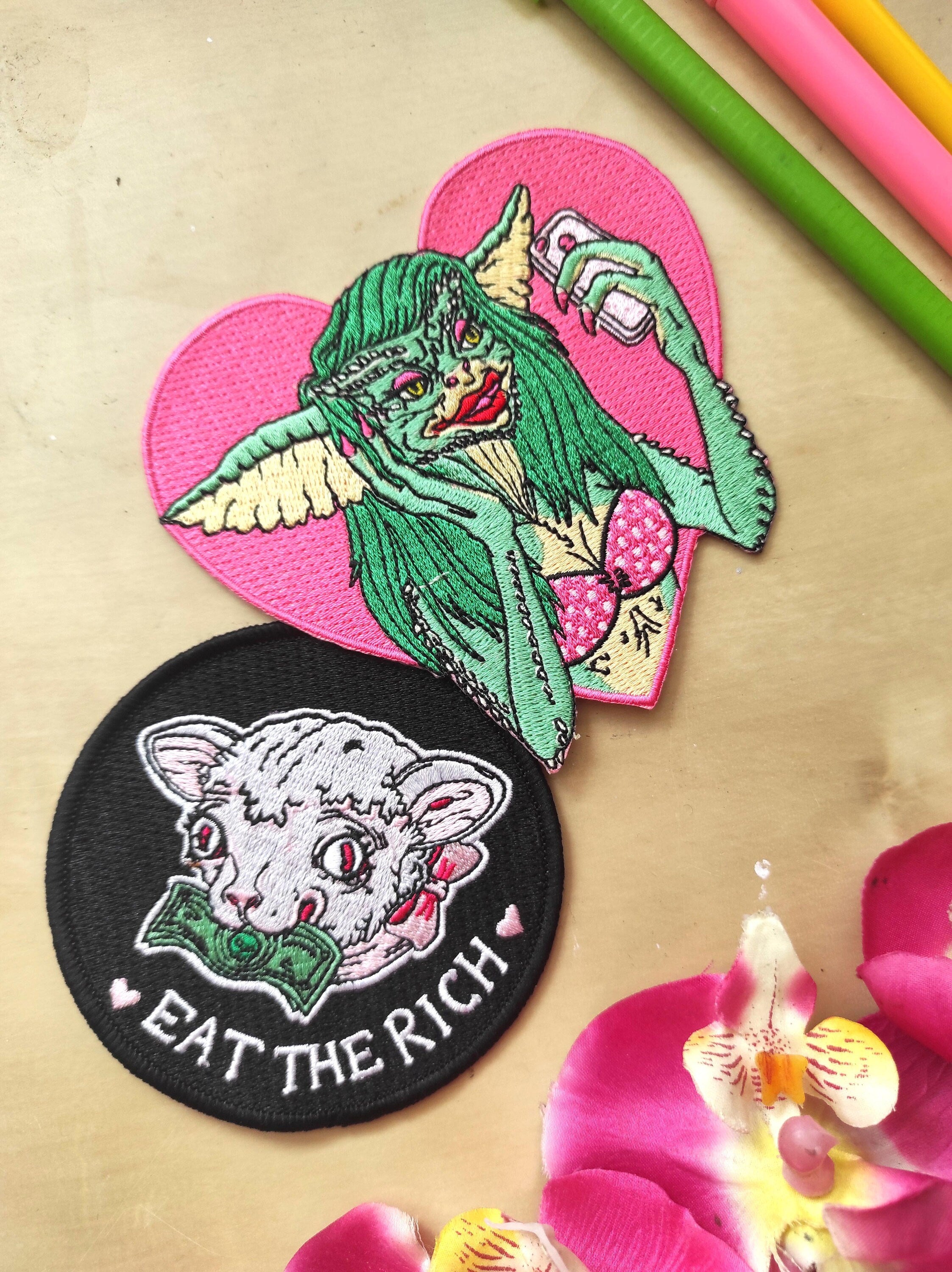 Greta The Gremlin Embroidered Patch featuring vibrant colors and playful design, measuring 12.5cm x 12.5cm.