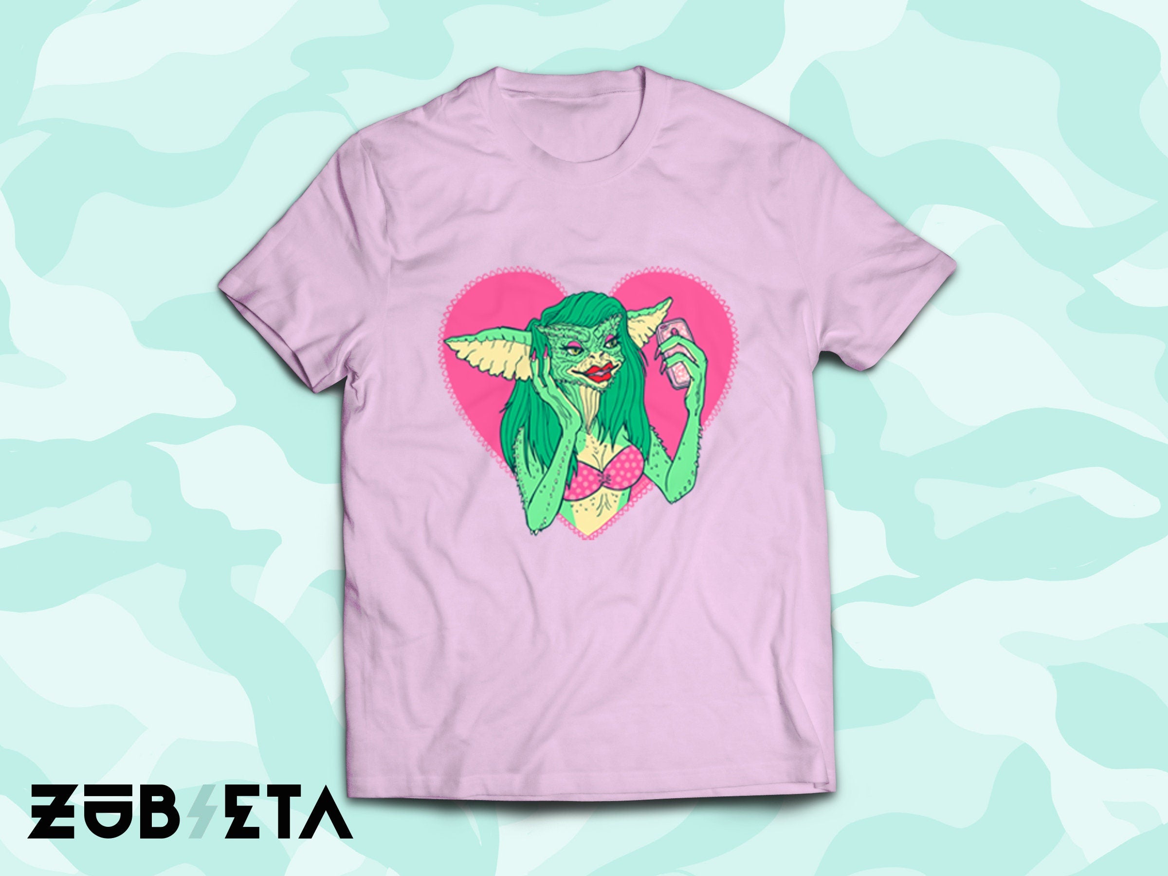 Greta the Gremlin pink organic cotton t-shirt featuring a vibrant print of the character Greta from The Gremlins movie.