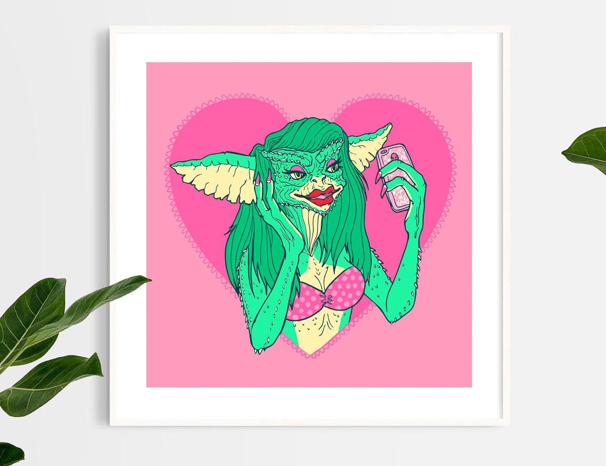 A vibrant gicleé fine art print of Greta the Gremlin, showcasing her charismatic expression with a white margin and handwritten details.