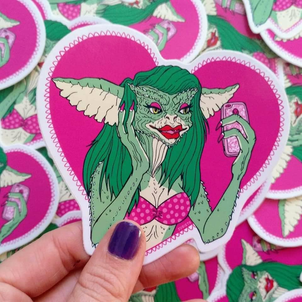 Greta The Gremlin Sticker featuring a cute gremlin design, perfect for decorating laptops and notebooks.