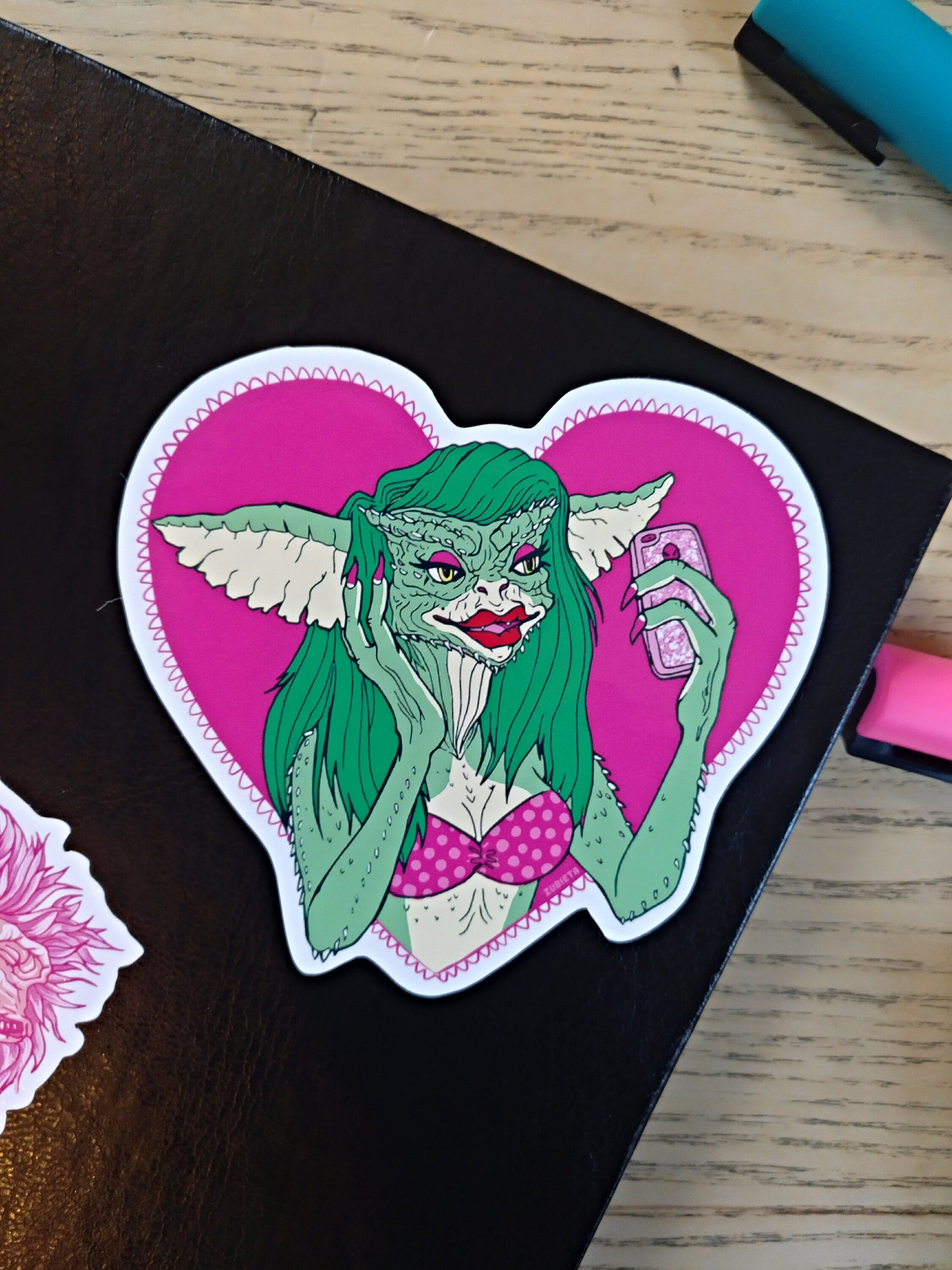 Greta The Gremlin Sticker featuring a cute gremlin design, perfect for decorating laptops and notebooks.