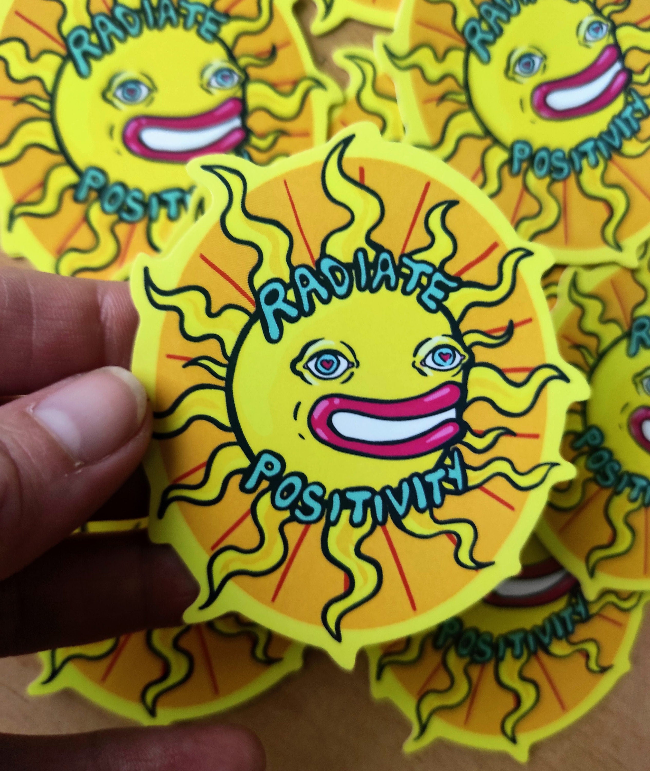 A vibrant Happy Sun Sticker featuring a psychedelic design, perfect for laptops, notebooks, and cars.