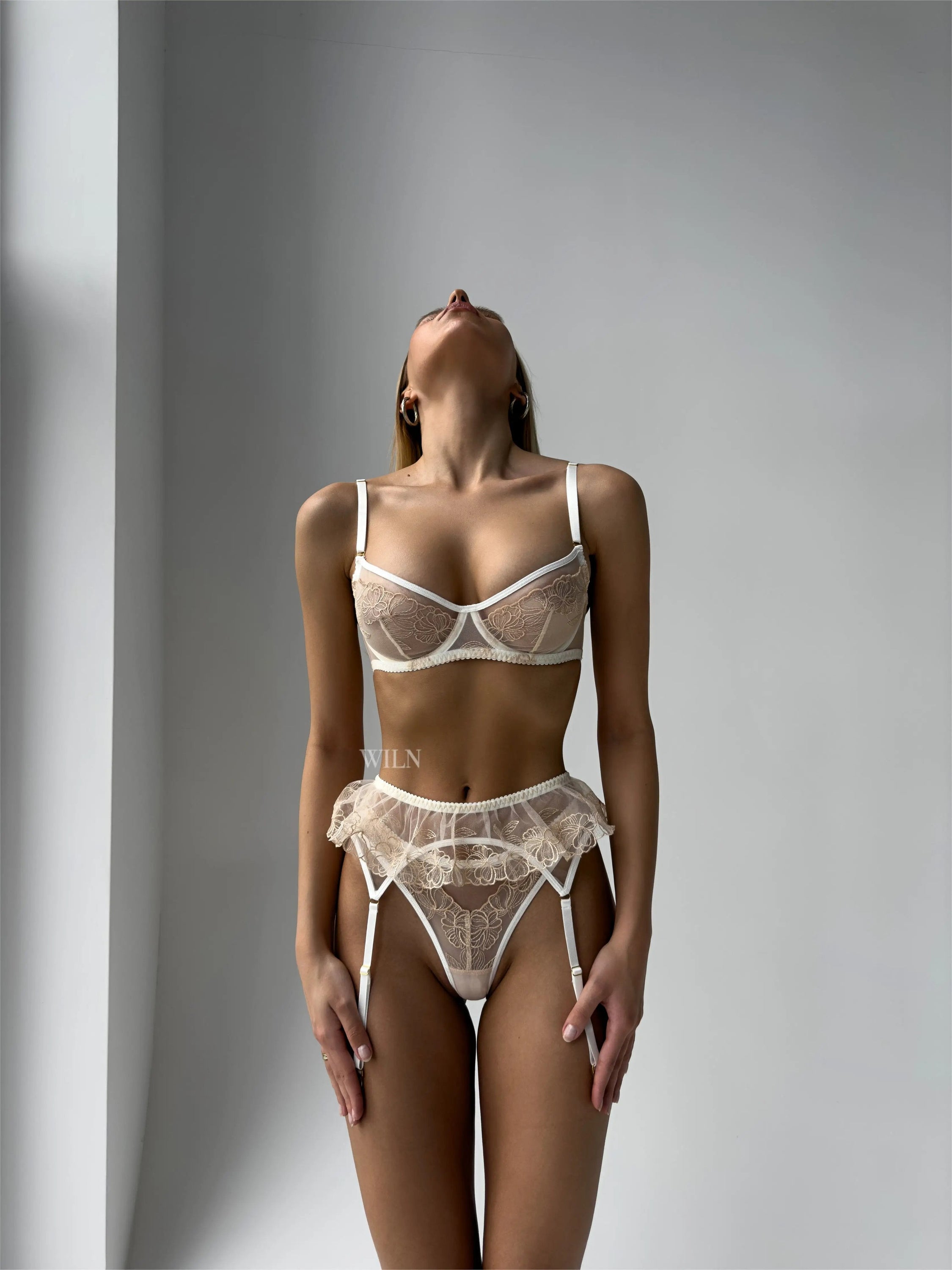 IDYLLIC 3 Piece Lingerie Set featuring floral lace and mesh underwire bra, suspender belt, and thong, elegantly displayed.