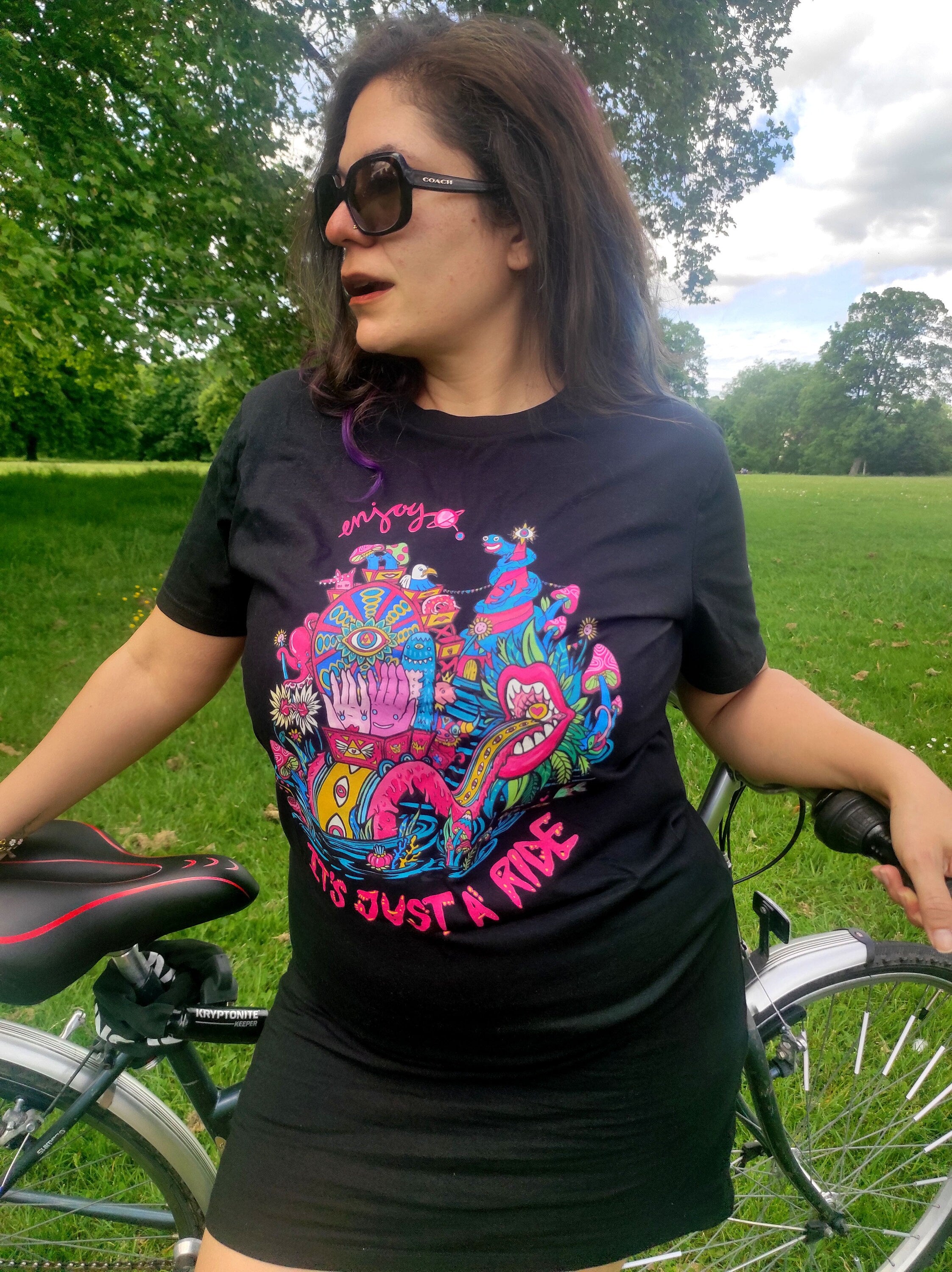 It Is Just A Ride Black Tee featuring psychedelic design inspired by Bill Hicks' quote, made from 100% cotton.