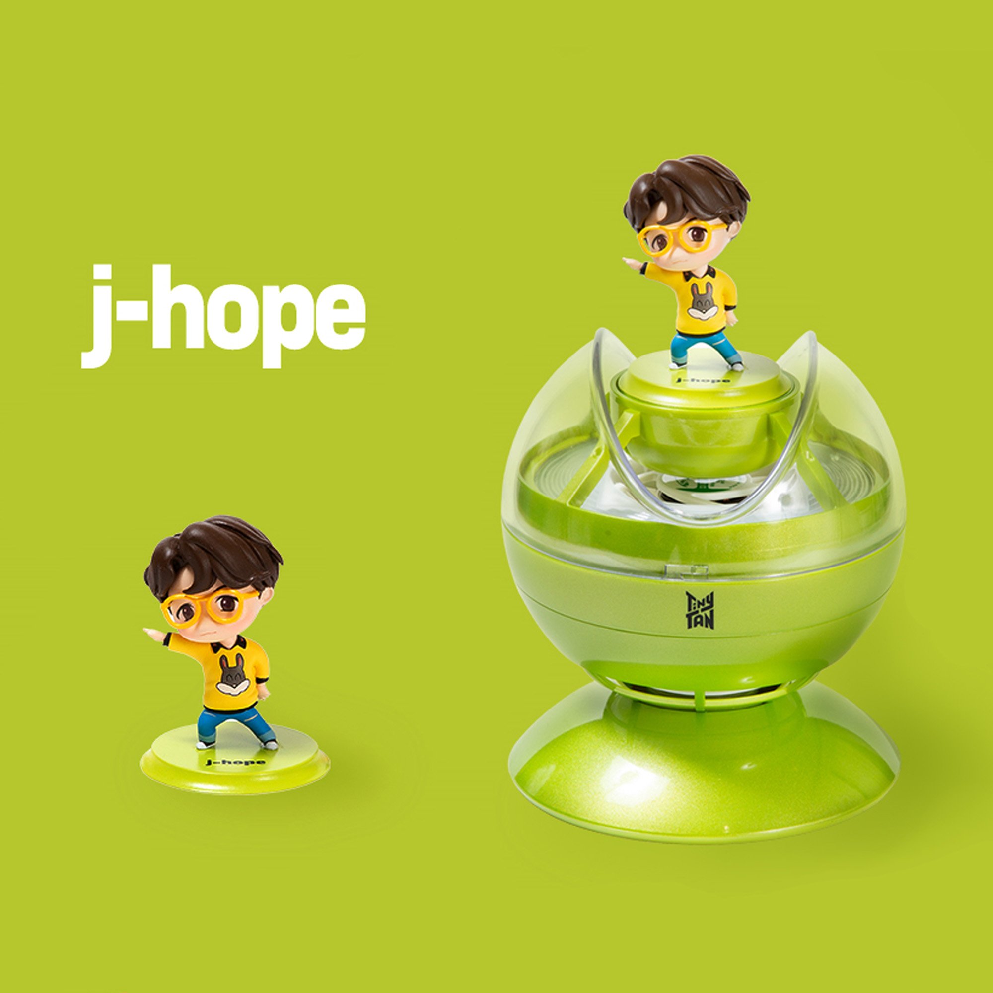 TinyTAN J-Hope figurine on green.