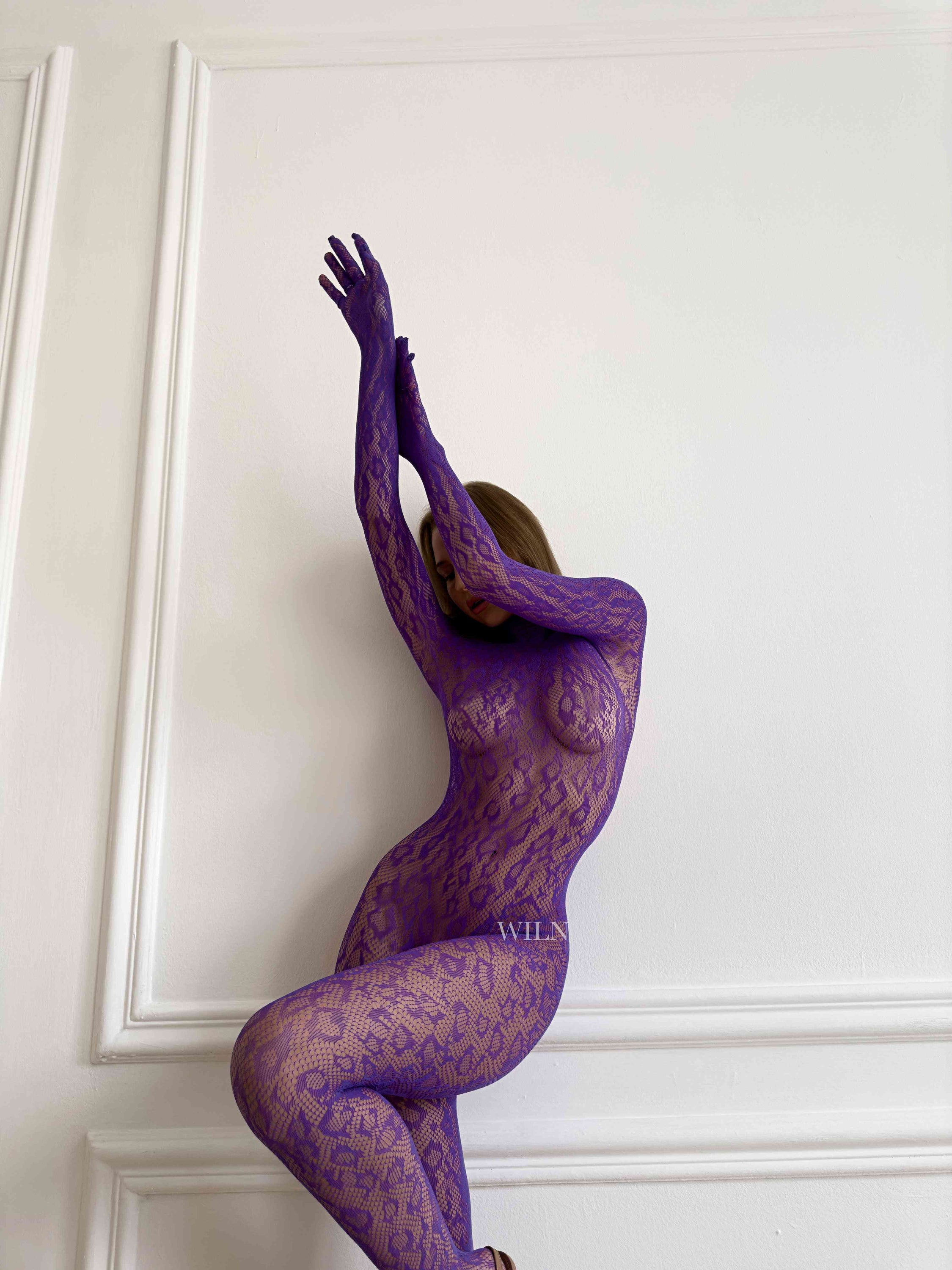 LIBIDO PURPLE Bodysuit featuring a flattering fishnet design, available in multiple colors, showcasing elegance and comfort.