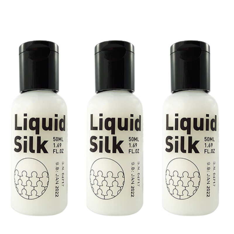 Three 50ml bottles of Liquid Silk water-based lubricant, showcasing its elegant packaging and luxurious design.