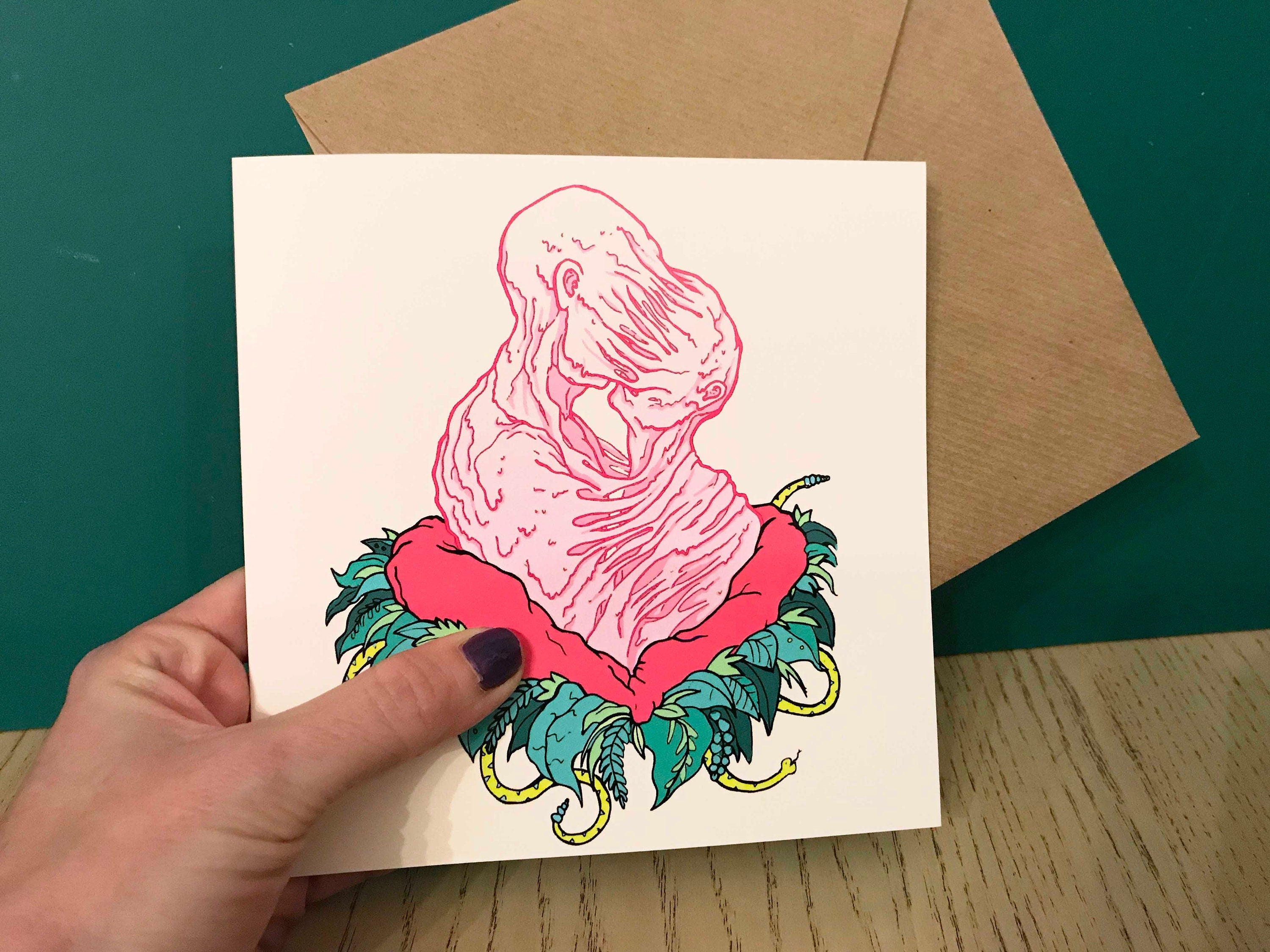 A quirky Lovers greeting card featuring vibrant digital art, with a recycled envelope and a sticker included.