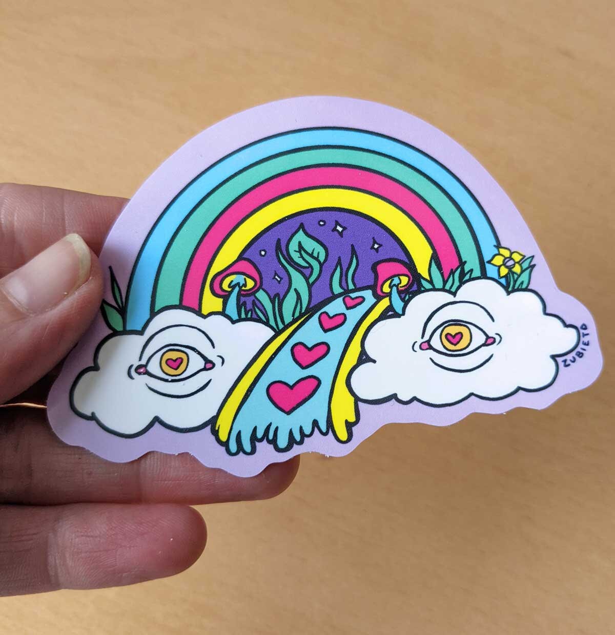 A colorful psychedelic rainbow vinyl sticker, showcasing vibrant hues and intricate designs, perfect for personalizing various items.