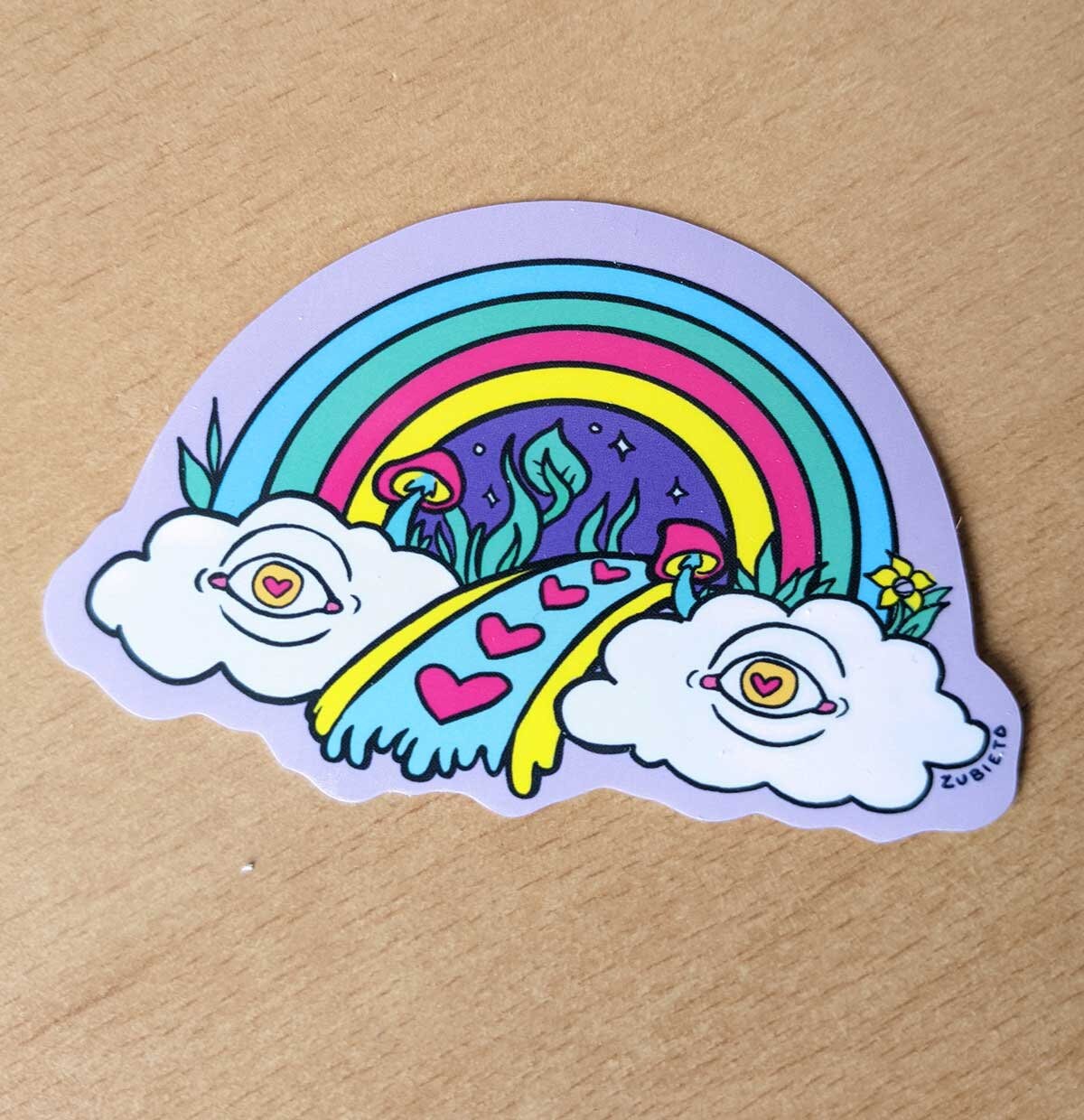 A colorful psychedelic rainbow vinyl sticker, showcasing vibrant hues and intricate designs, perfect for personalizing various items.