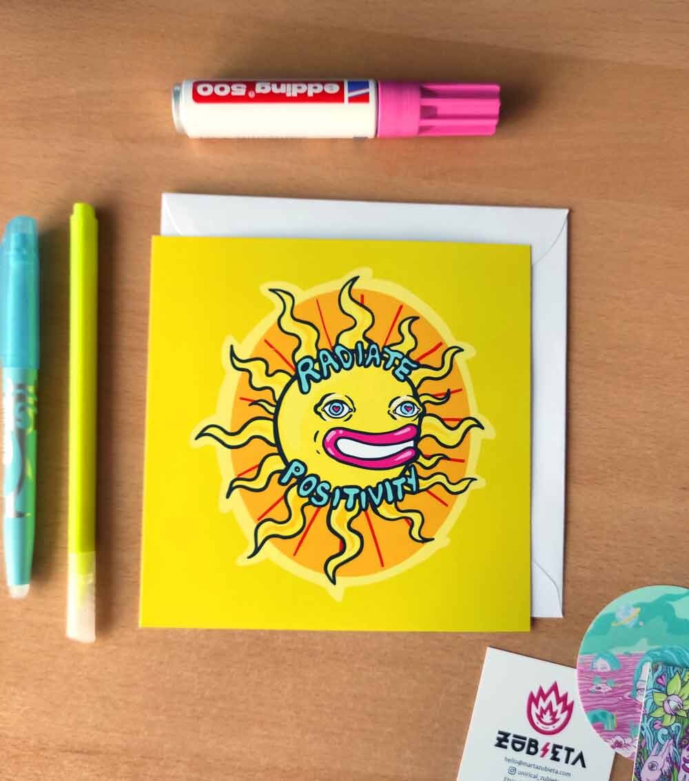 A vibrant psychedelic card titled 'Radiate Positivity', featuring colorful designs symbolizing love and friendship, with a square envelope and sticker.