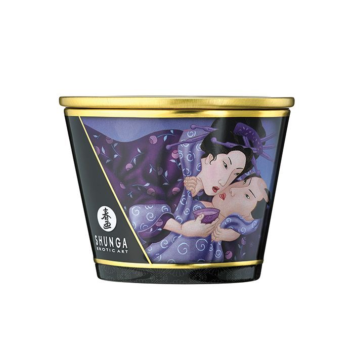 Shunga Libido Massage Candlelight in Exotic Fruits scent, showcasing a beautifully designed candle with a warm glow, perfect for romantic settings.