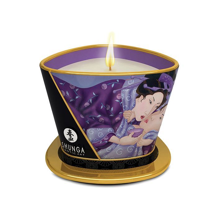 Shunga Libido Massage Candlelight in Exotic Fruits scent, showcasing a beautifully designed candle with a warm glow, perfect for romantic settings.