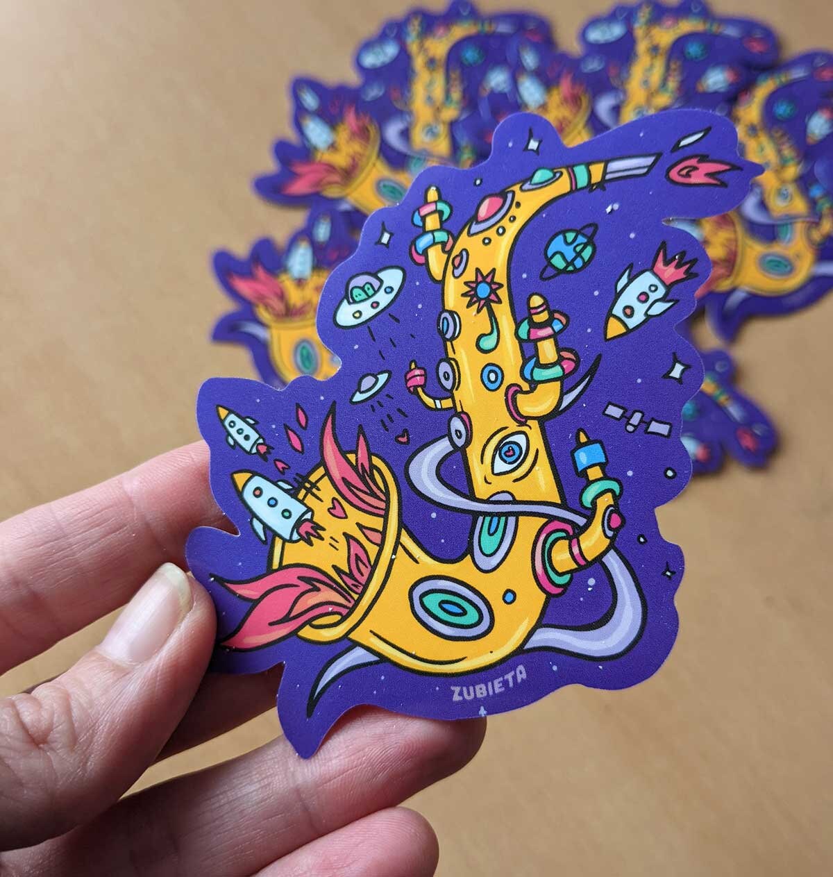 Colorful Spacey Sax sticker featuring a saxophone design, perfect for decorating personal items.