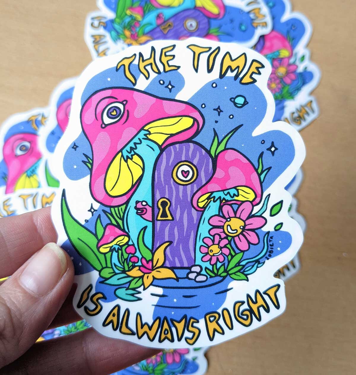 Colorful vinyl sticker featuring psychedelic mushrooms and a rainbow design, perfect for personalizing items.