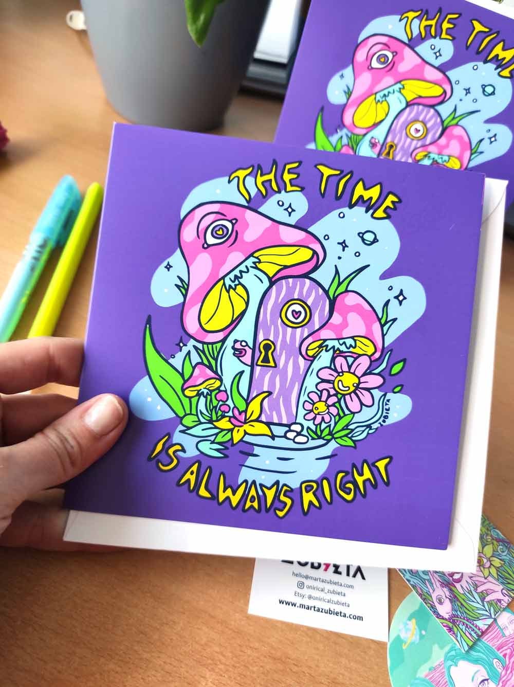 A vibrant psychedelic greeting card titled 'The Time Is Always Right', featuring colorful digital art, a square envelope, and a sticker.