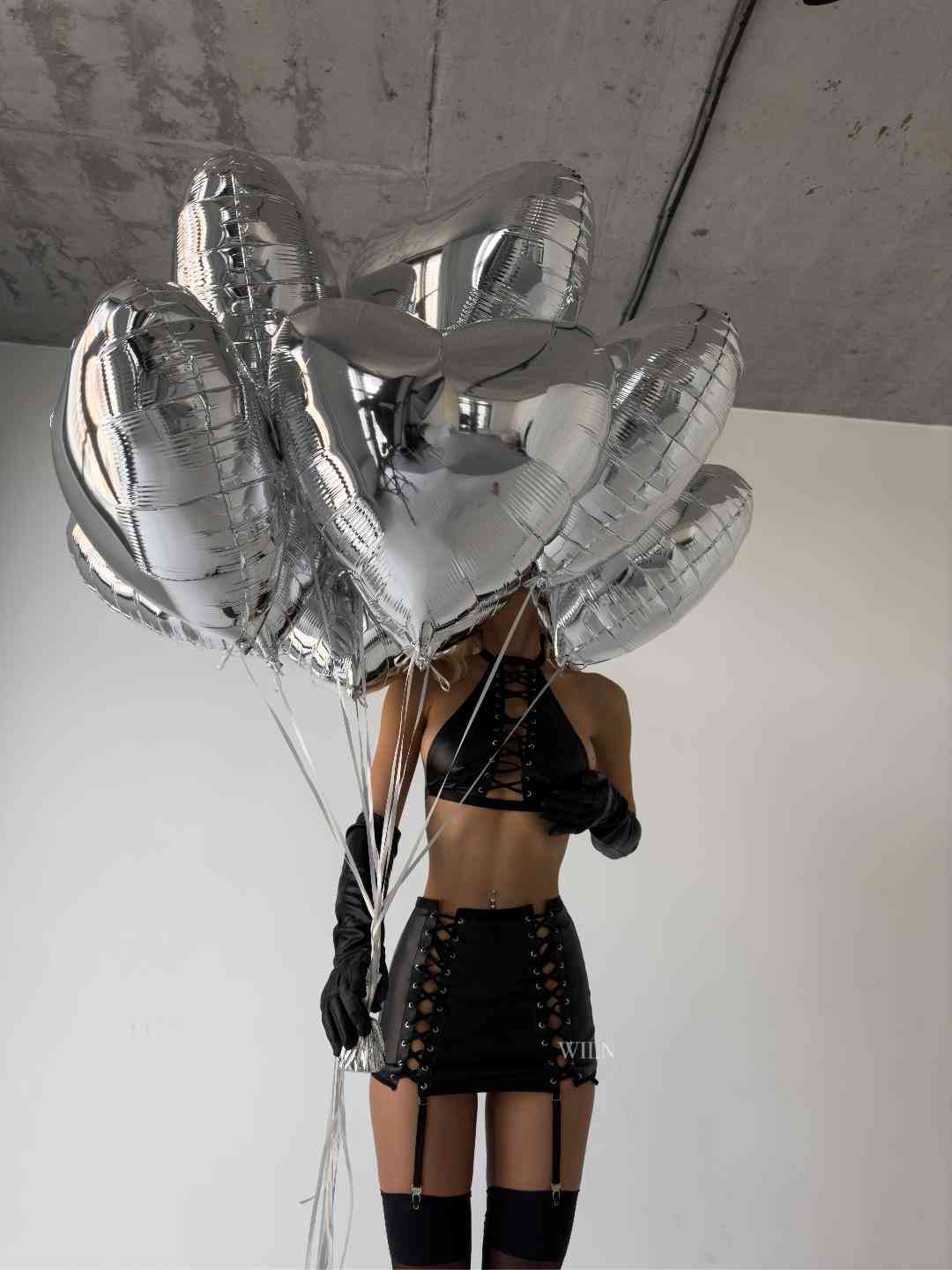 TOXIC 3 Piece Lingerie Set featuring a halterneck bralette, matching garter skirt, and glossy stockings in elegant black.