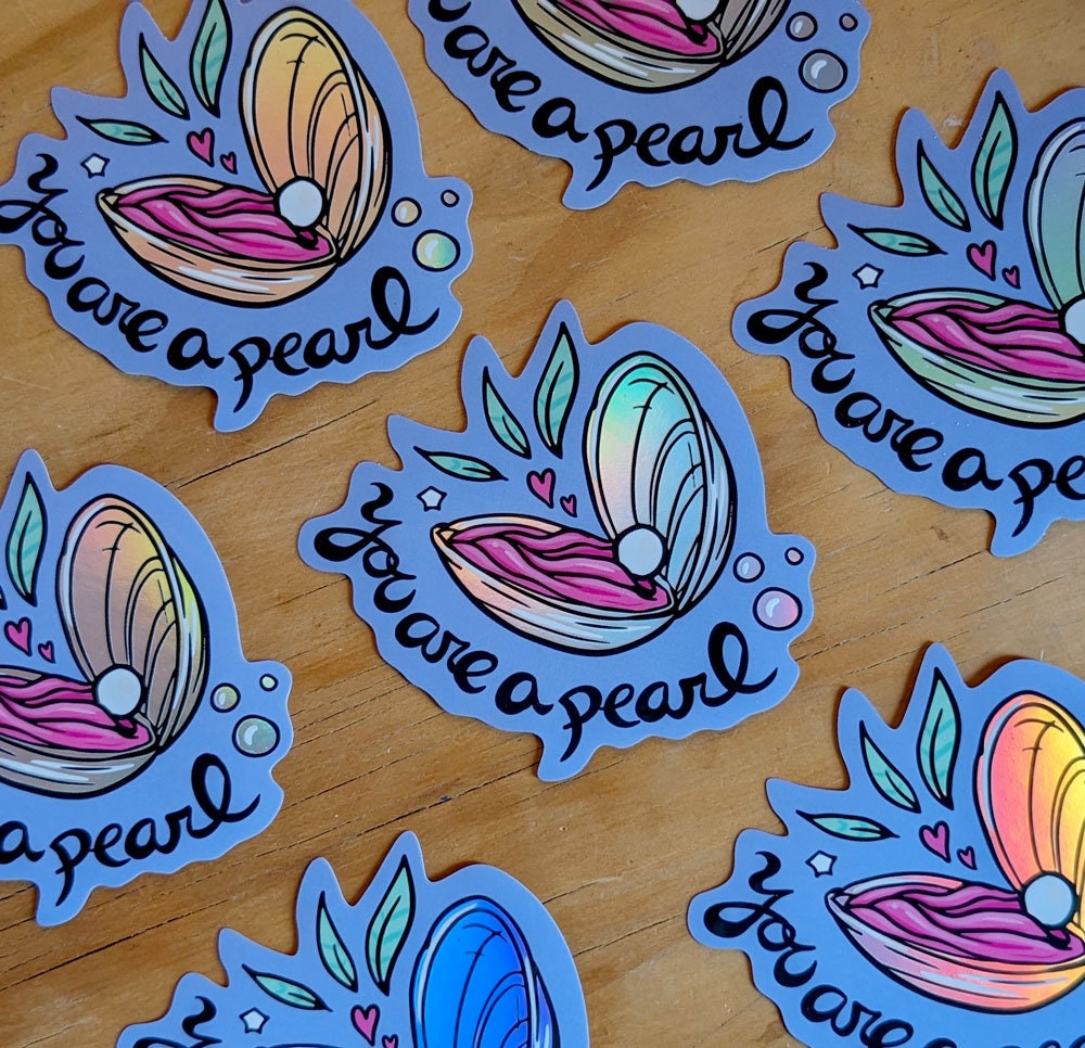 You Are a Pearl Holographic Vinyl Sticker featuring an oyster shell design with a shimmering holographic finish.