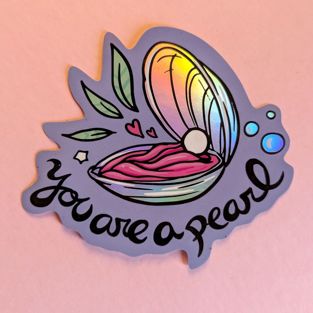 You Are a Pearl Holographic Vinyl Sticker featuring an oyster shell design with a shimmering holographic finish.