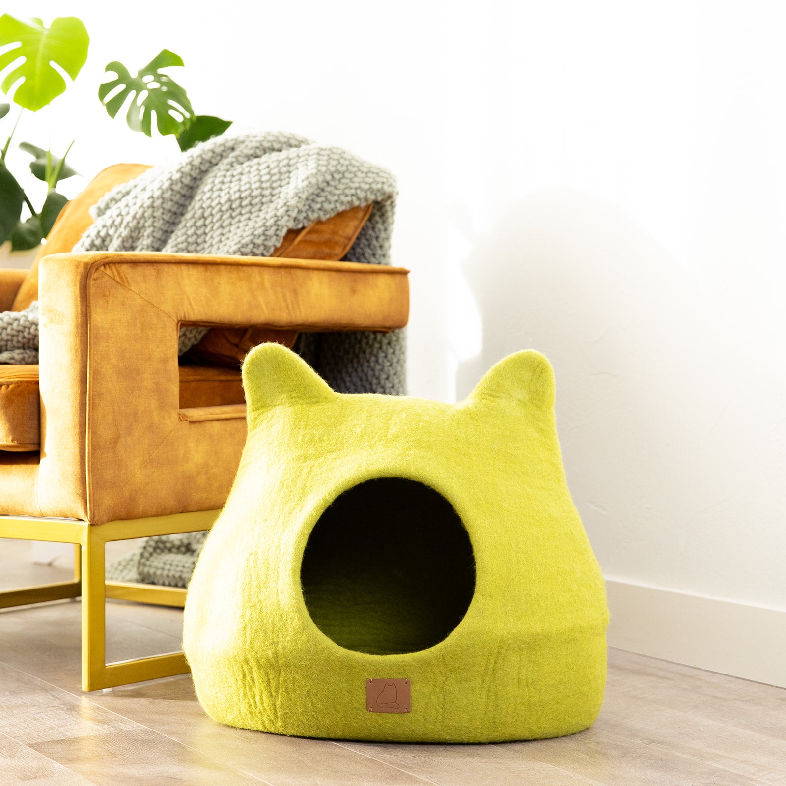 Citrus Green Ear Style Cave made of luxurious felted wool, featuring a peekaboo design for cats to snuggle and play comfortably.