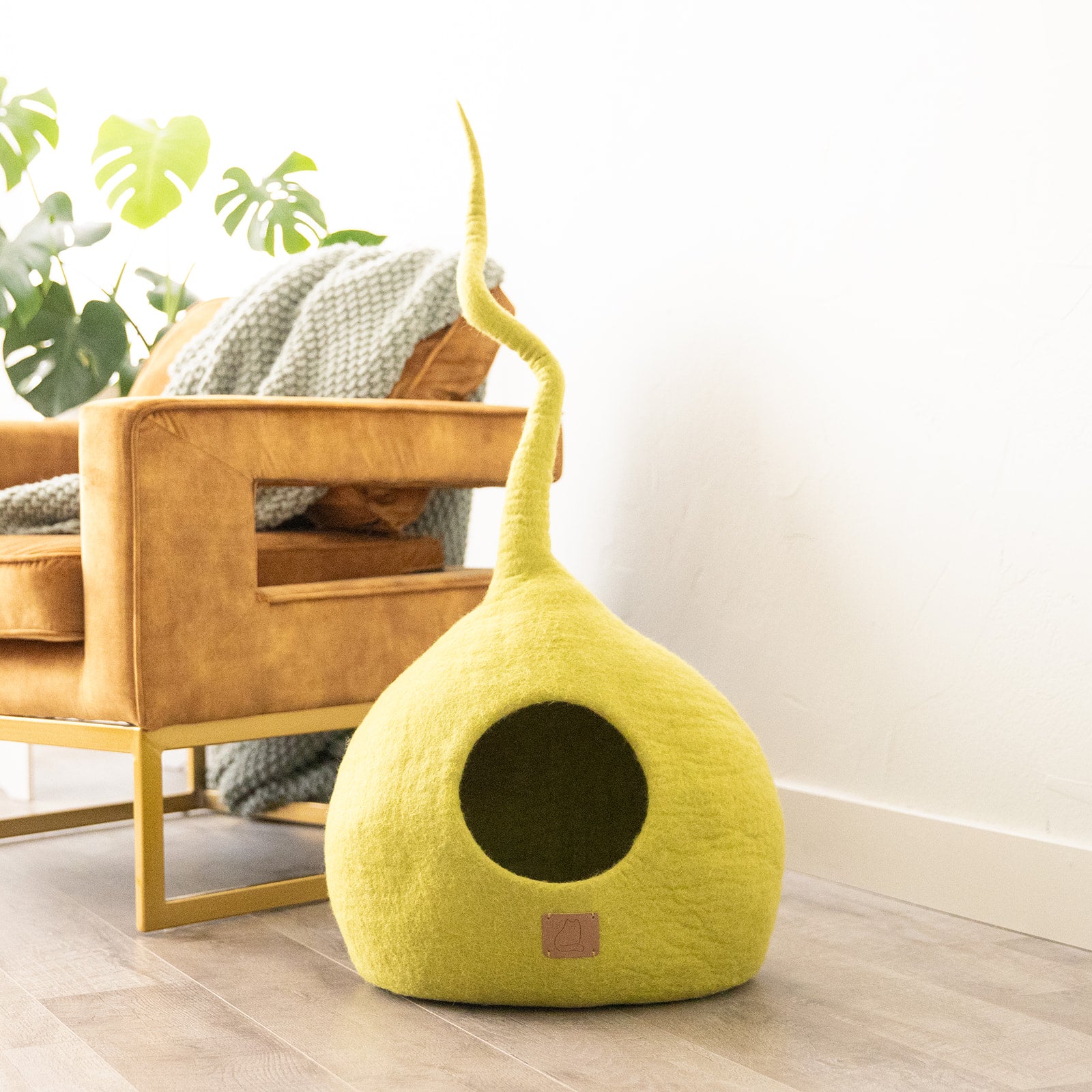 Citrus Green Tail Style Cave, a modern cat cave made of felted wool, featuring a peekaboo entrance and a vibrant color, perfect for stylish pet owners.