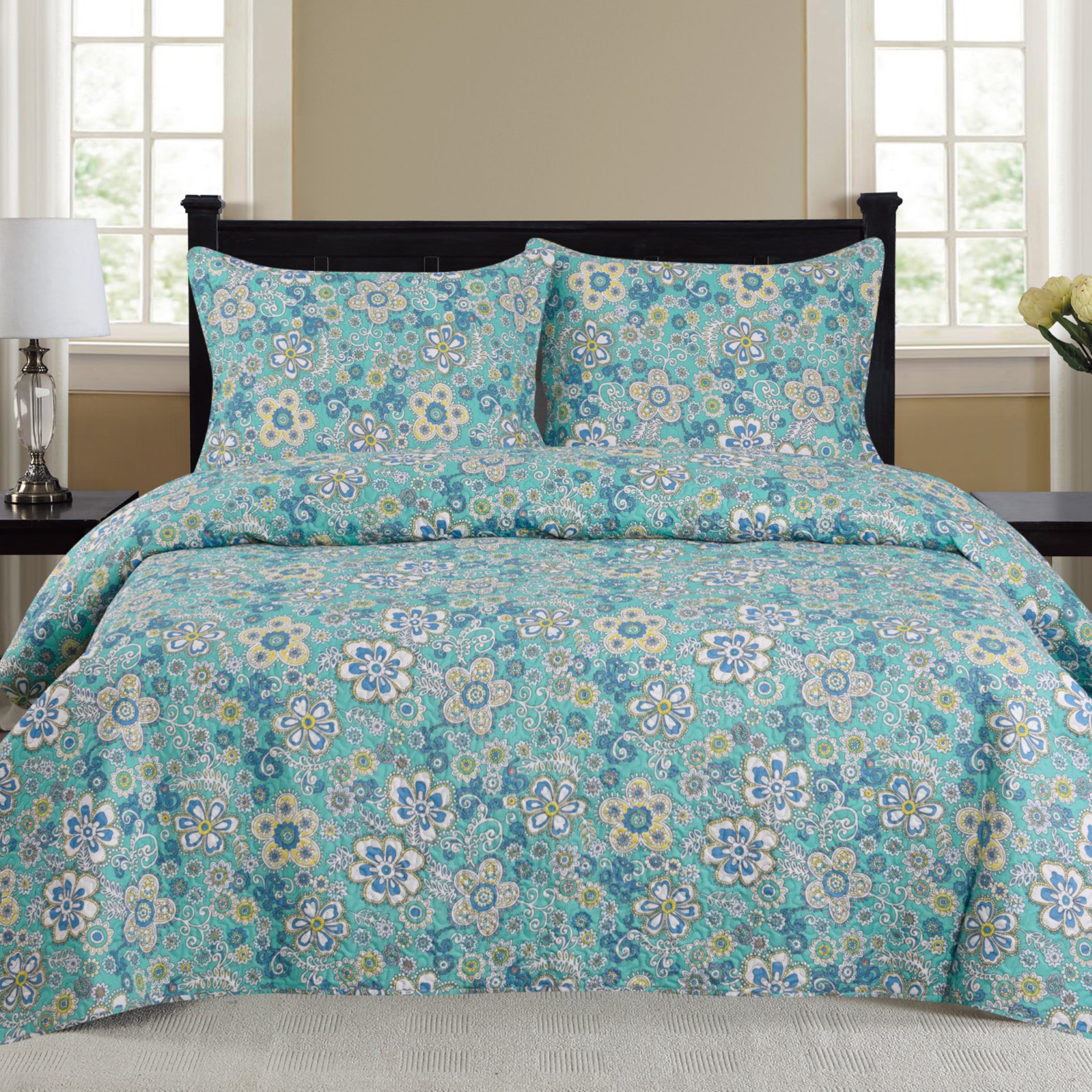 Cynthia 3 Piece Quilt Set in Turquoise featuring a quilt and two matching pillow shams, showcasing vibrant color and elegant design.