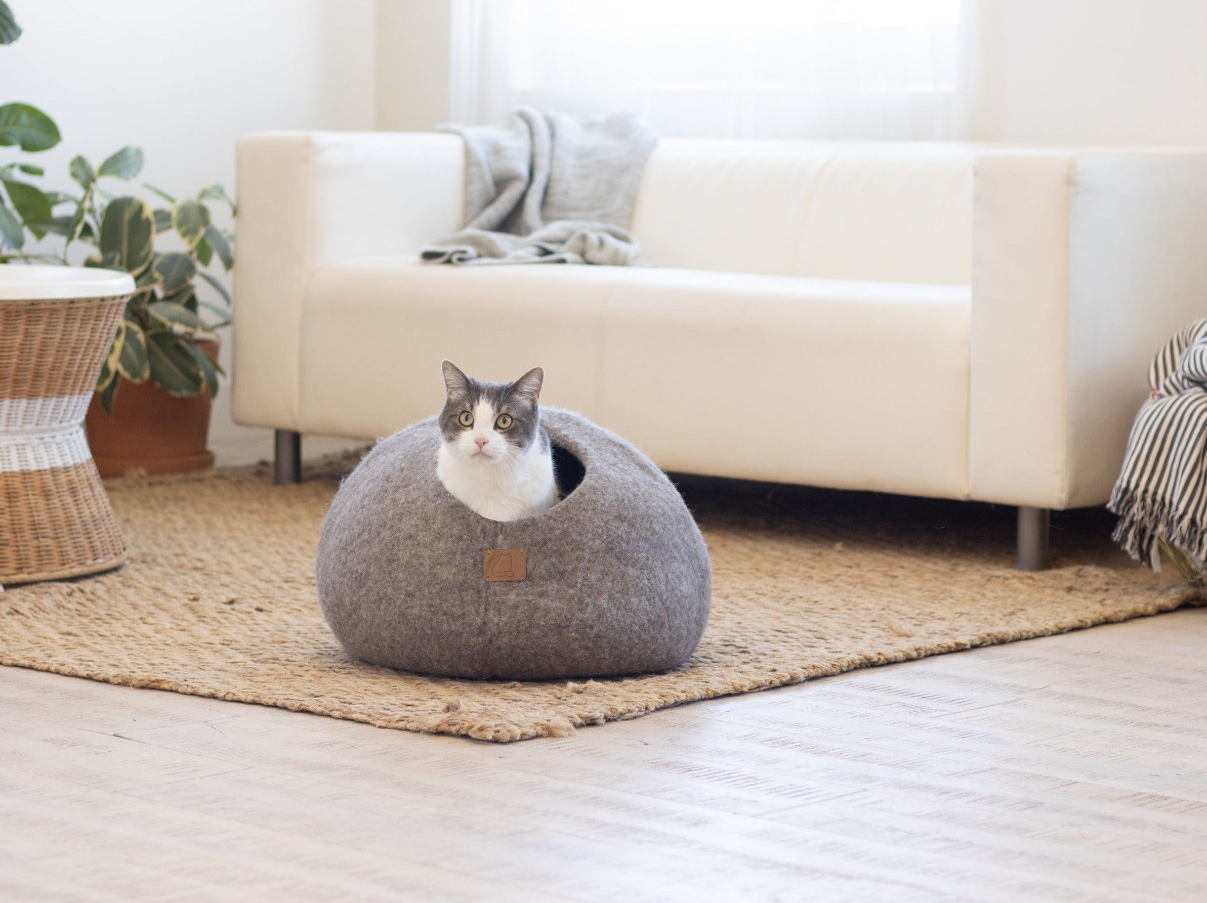 Earth Brown round style cat cave bed made from luxurious felted wool, designed for comfort and style, suitable for all cat sizes.