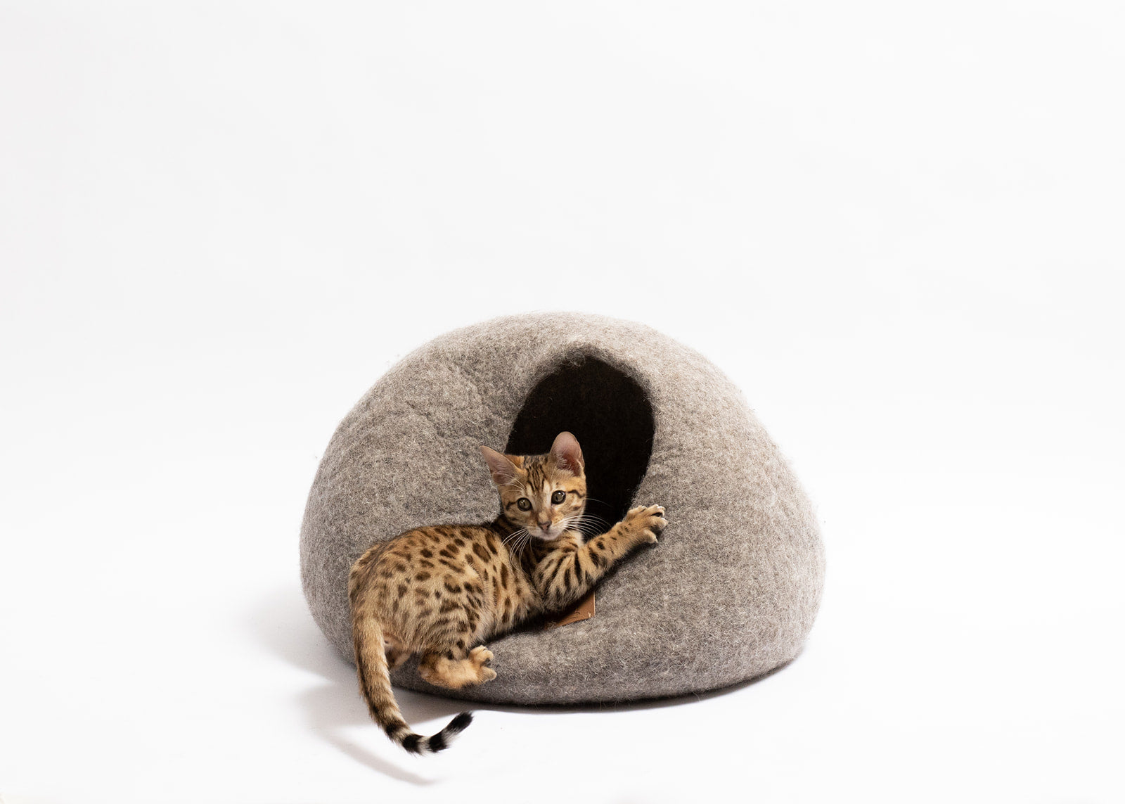 Earth Brown round style cat cave bed made from luxurious felted wool, designed for comfort and style, suitable for all cat sizes.