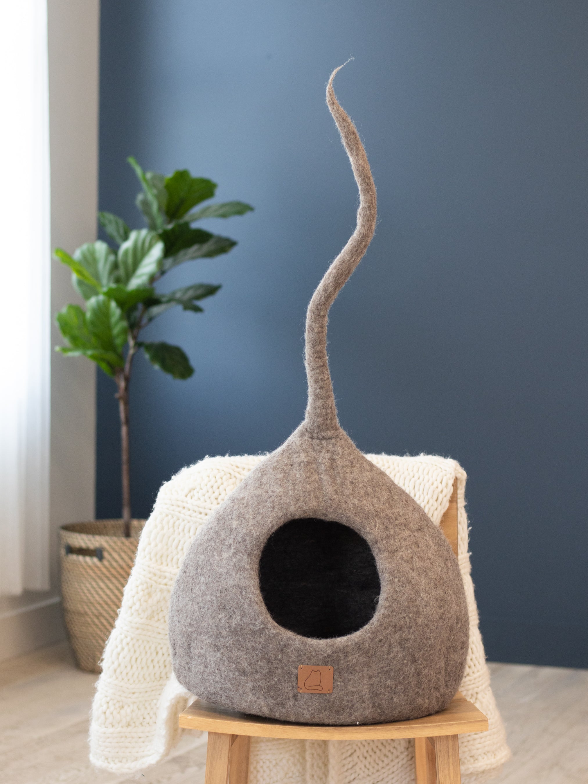 Earth Brown Tail Style Cave, a cozy and stylish cat cave made from premium felted wool, featuring a peekaboo entrance and modern design.