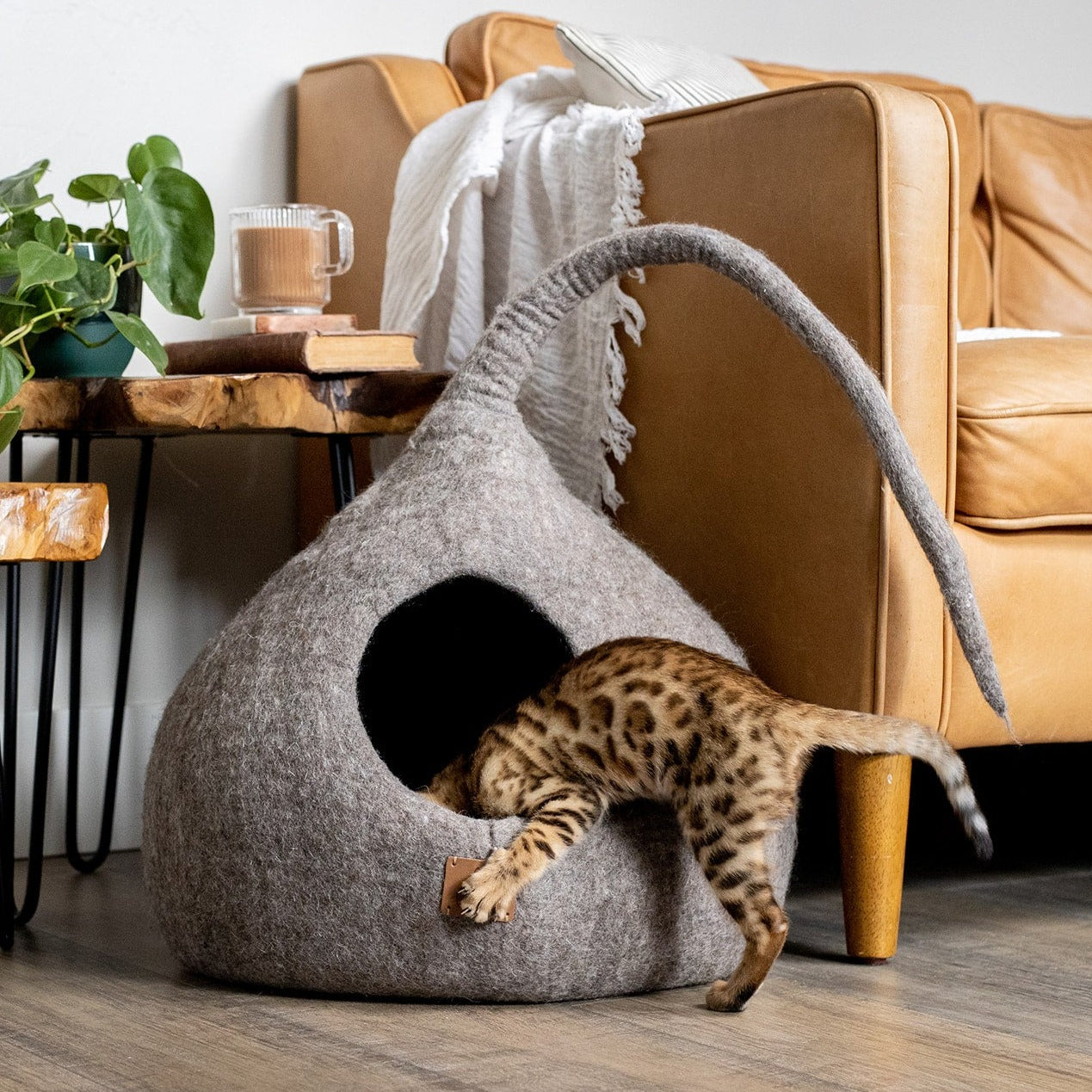 Earth Brown Tail Style Cave, a cozy and stylish cat cave made from premium felted wool, featuring a peekaboo entrance and modern design.