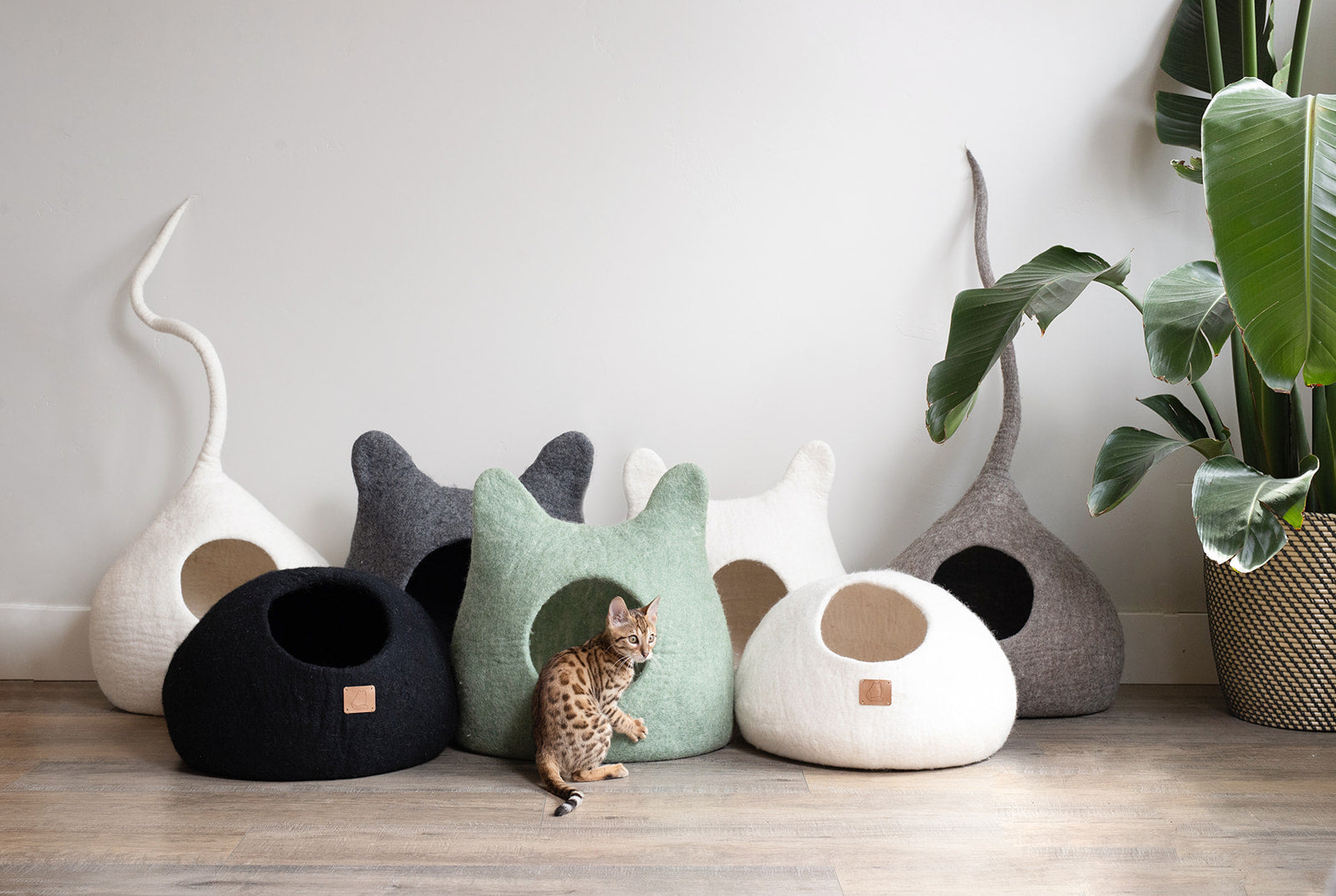 Earth Brown Tail Style Cave, a cozy and stylish cat cave made from premium felted wool, featuring a peekaboo entrance and modern design.