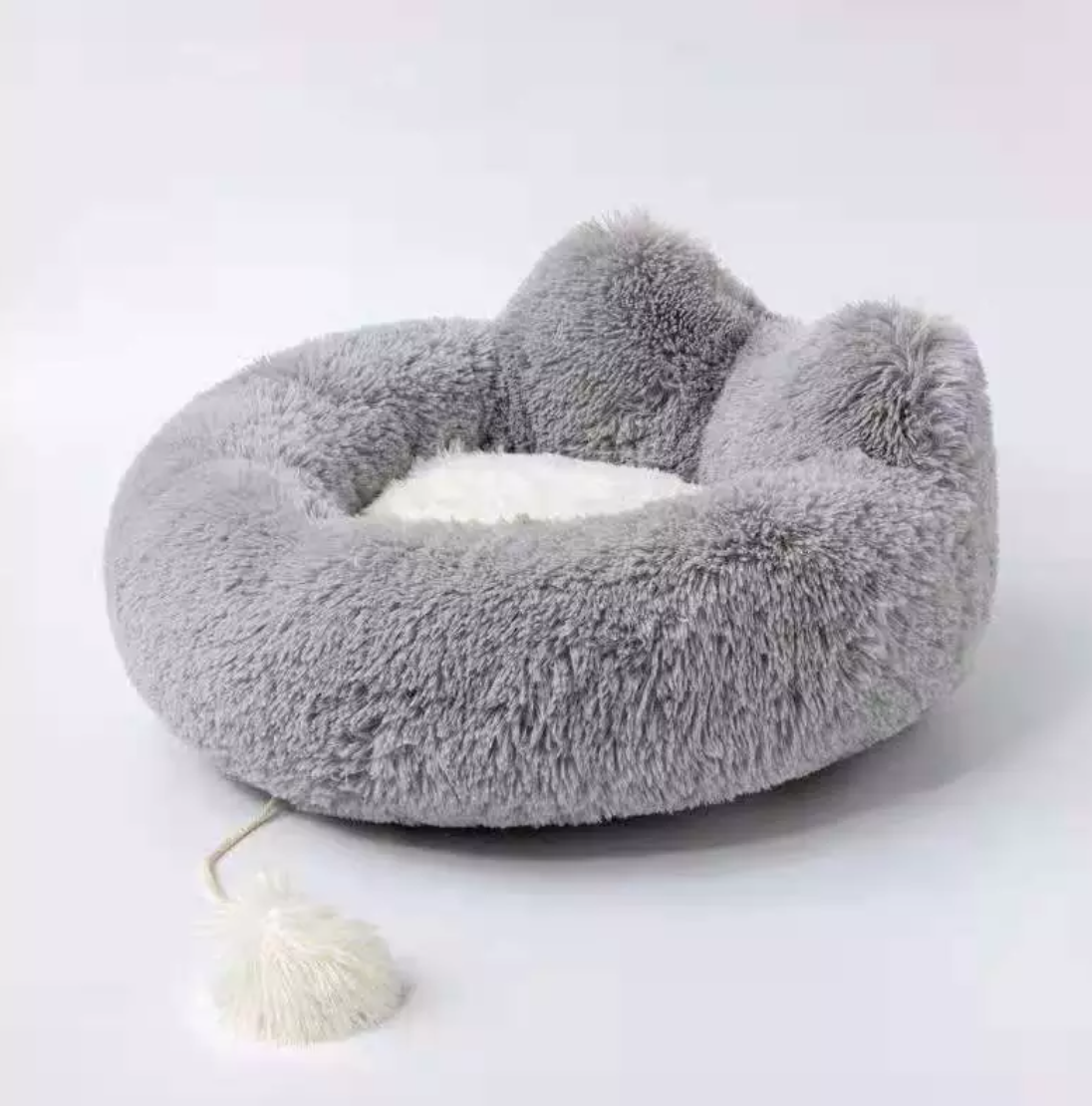 Cozy Plush Pet Bed in soft plush material, featuring a non-slip base, perfect for pets to curl up and relax.