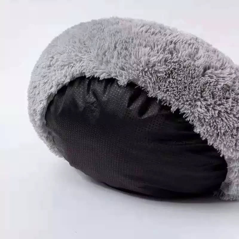 Cozy Plush Pet Bed in soft plush material, featuring a non-slip base, perfect for pets to curl up and relax.