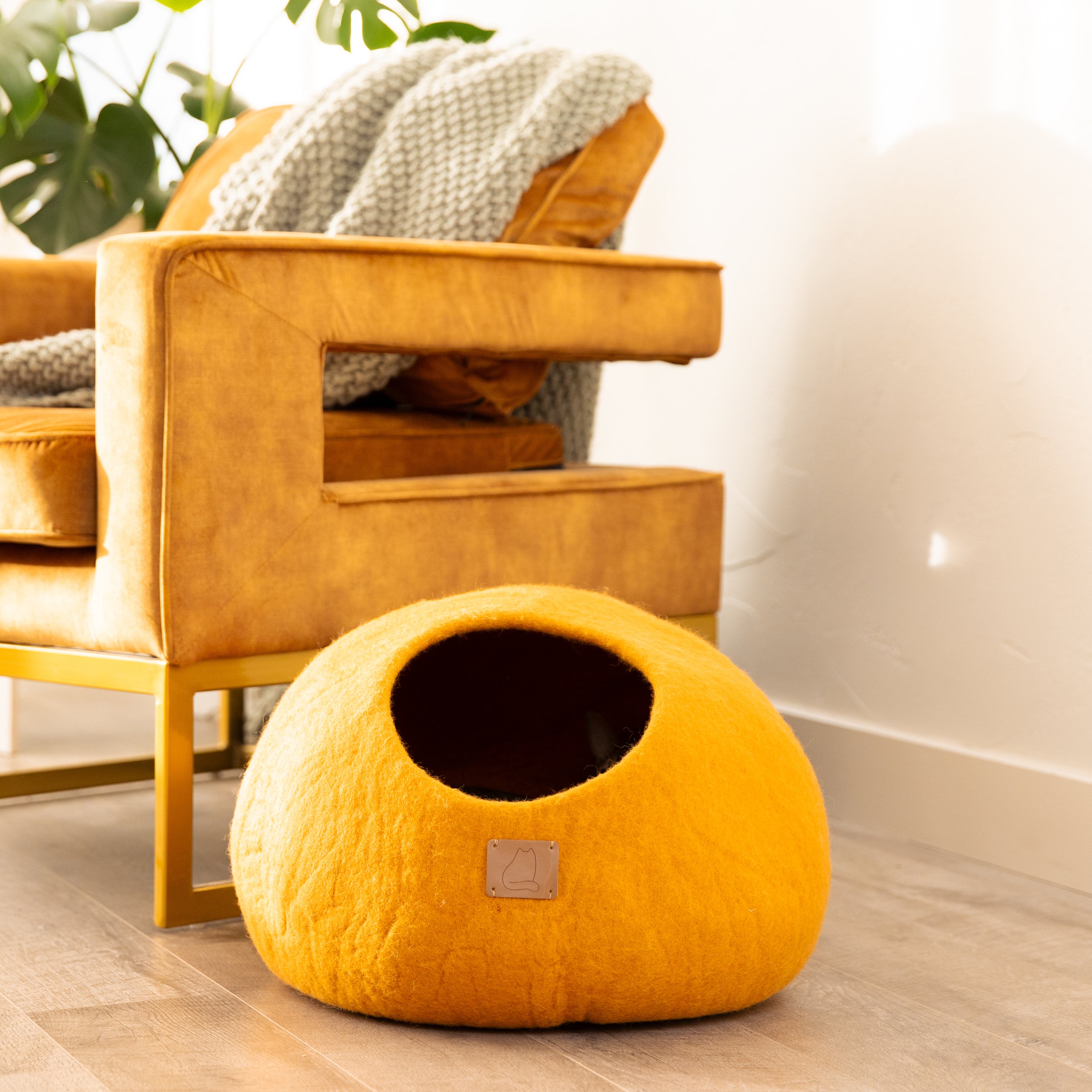 Fire Orange Round Style Cave, a cozy felted wool cat bed with a peekaboo design, perfect for cats of all sizes.