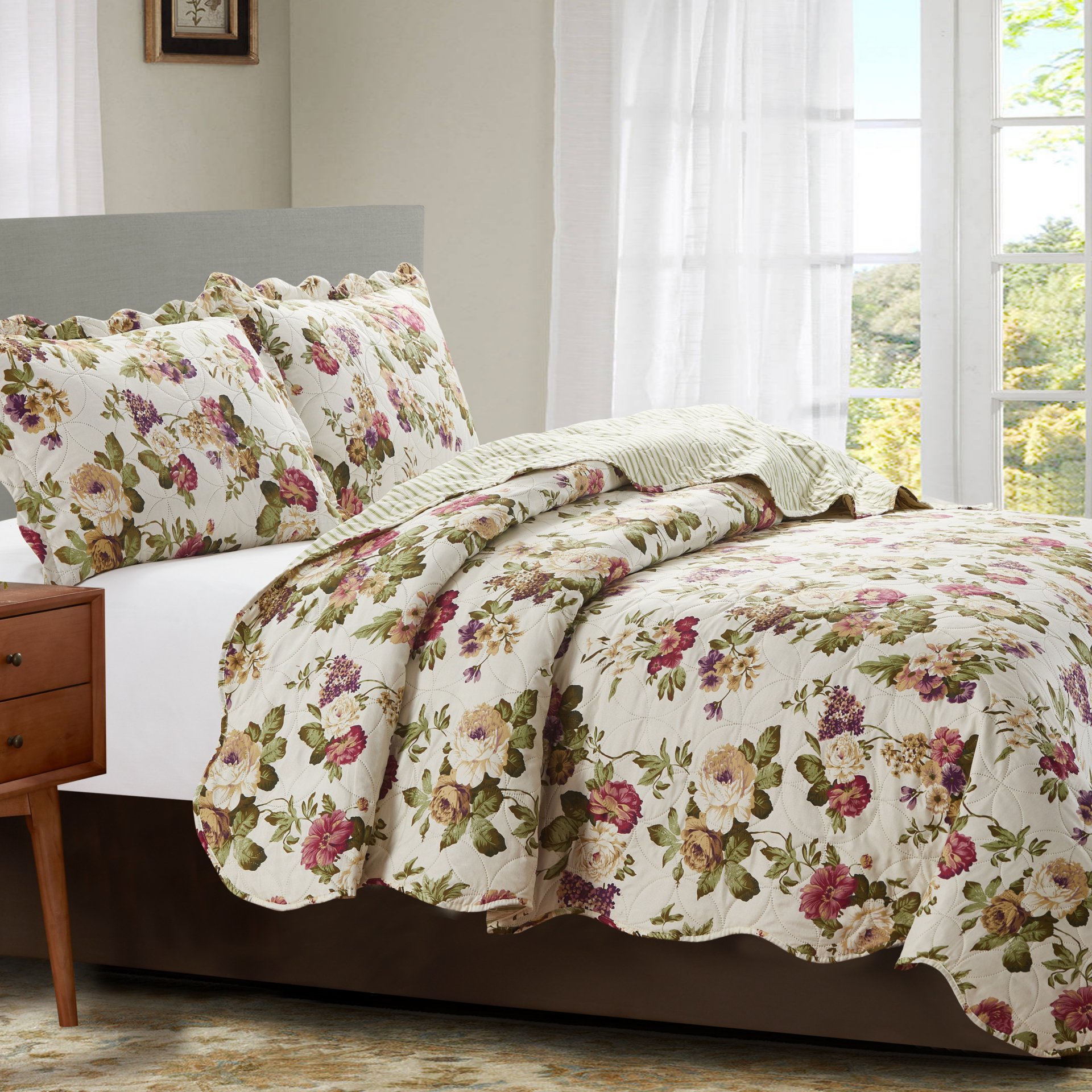 Jennifer 3 Piece Quilt Set in Green, featuring a quilt and two matching pillow shams, elegantly displayed on a bed.