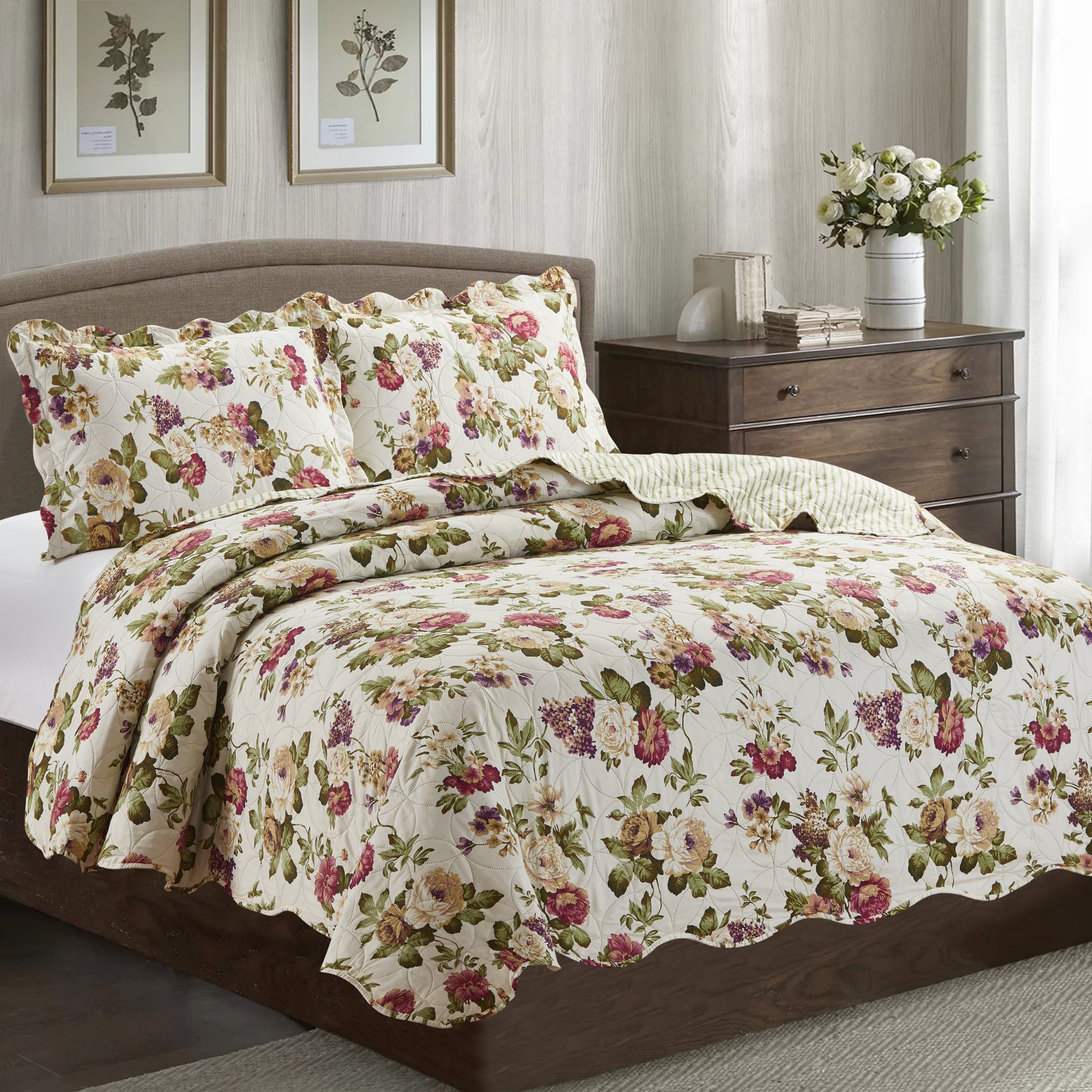 Jennifer 3 Piece Quilt Set in Green, featuring a quilt and two matching pillow shams, elegantly displayed on a bed.