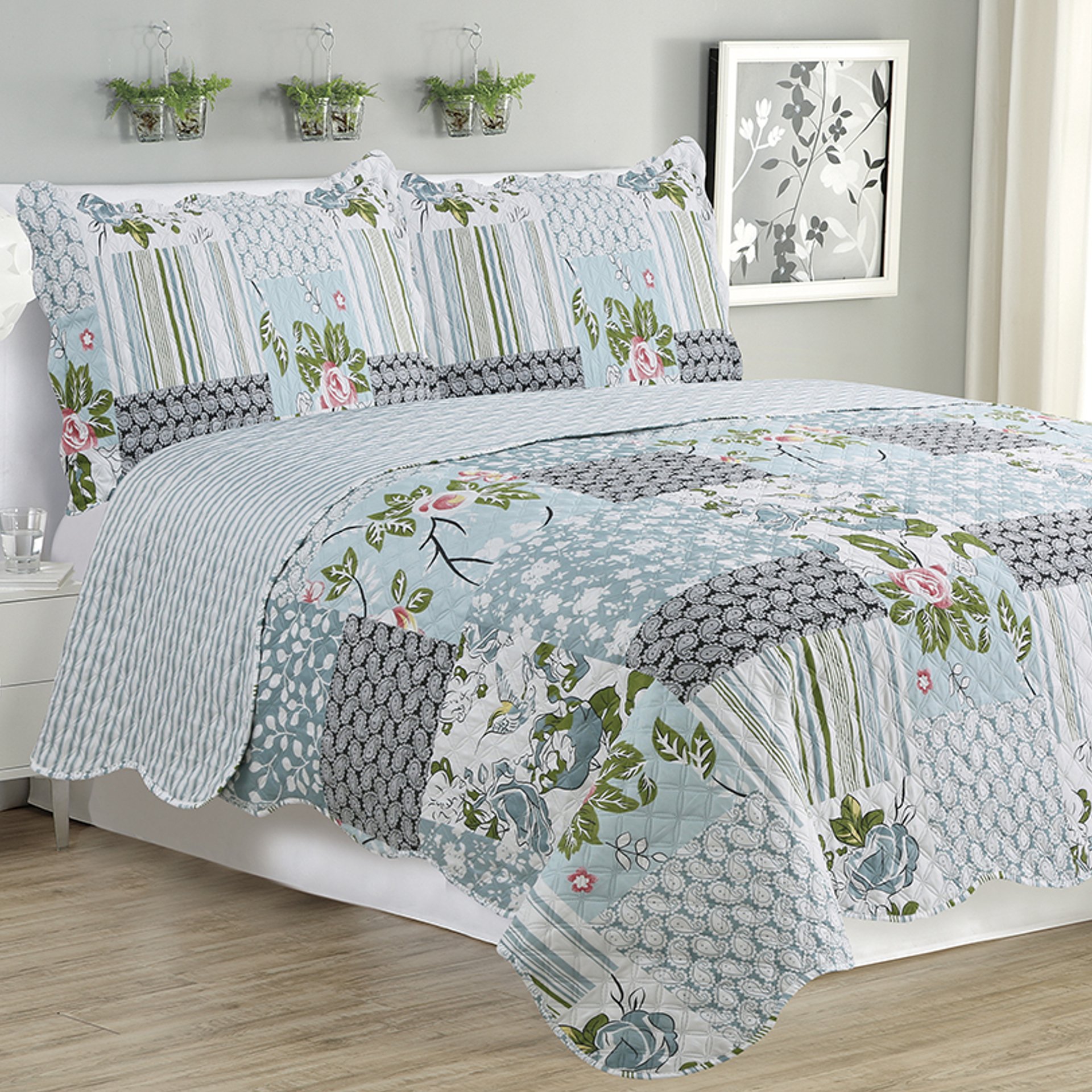 Kim 3 Piece Quilt Set featuring a silver bird floral design, includes quilt and two pillow shams, displayed on a neatly made bed.