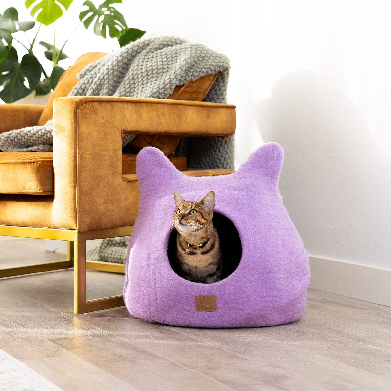 Lilac Purple Ear Style Cave made of felted wool, featuring a cozy design with a peekaboo opening, perfect for cats to snuggle and play.