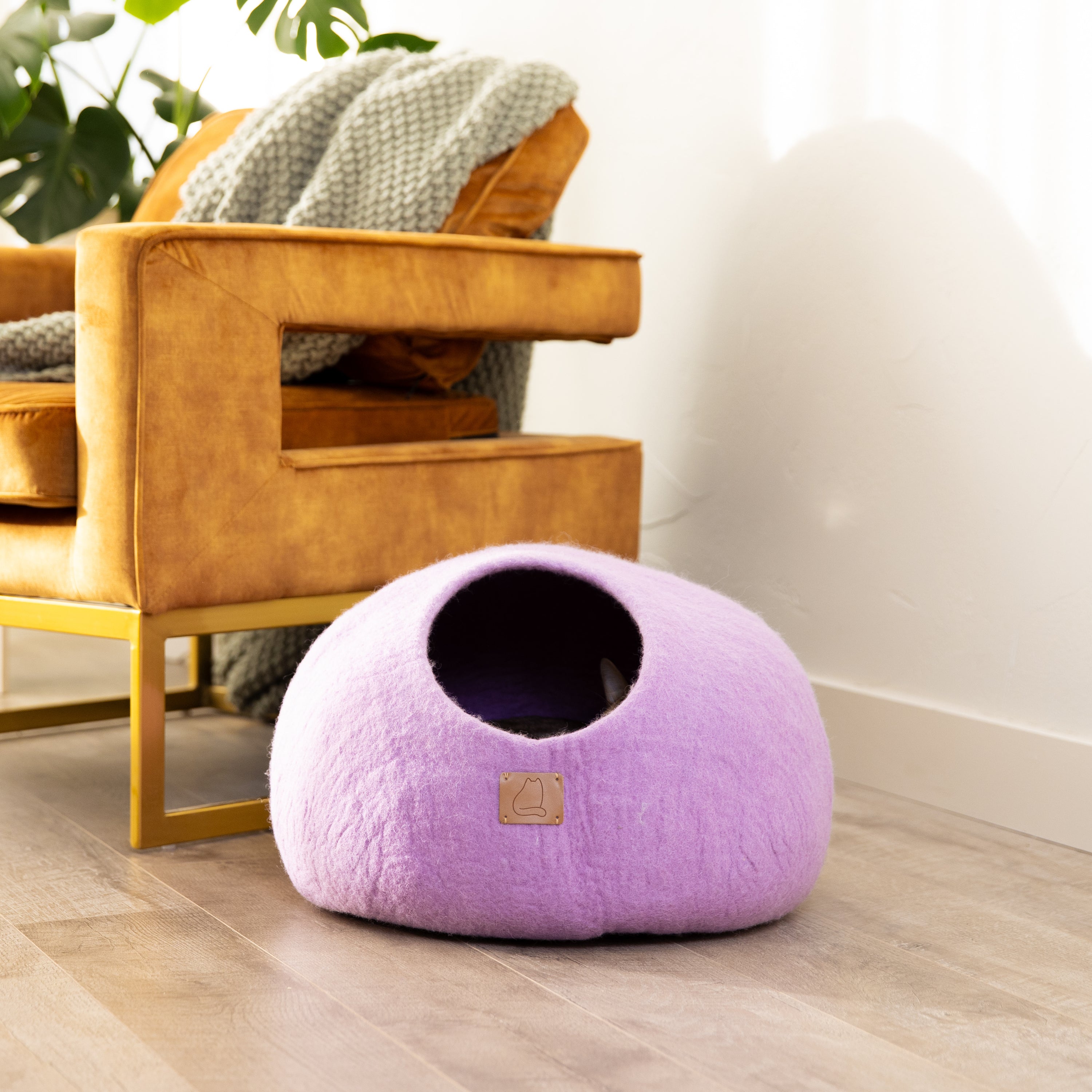 Lilac Purple round style cat cave bed made from felted wool, featuring a cozy and spacious design for cats to relax and play.