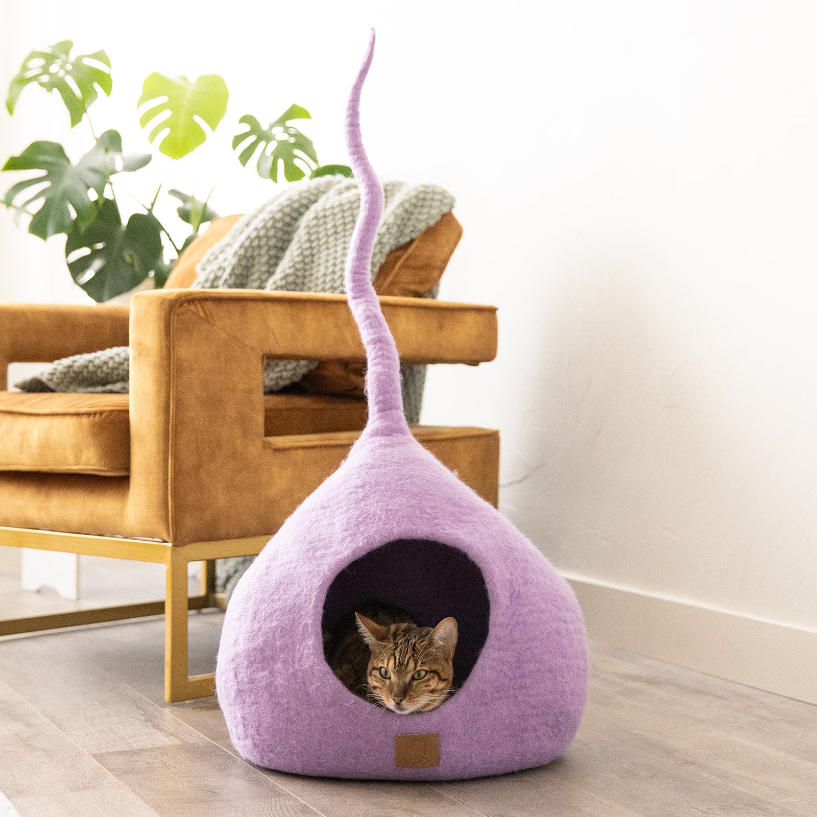 Lilac Purple Tail Style Cave, a cozy and stylish cat bed made from felted wool, featuring a peekaboo entrance and modern design.