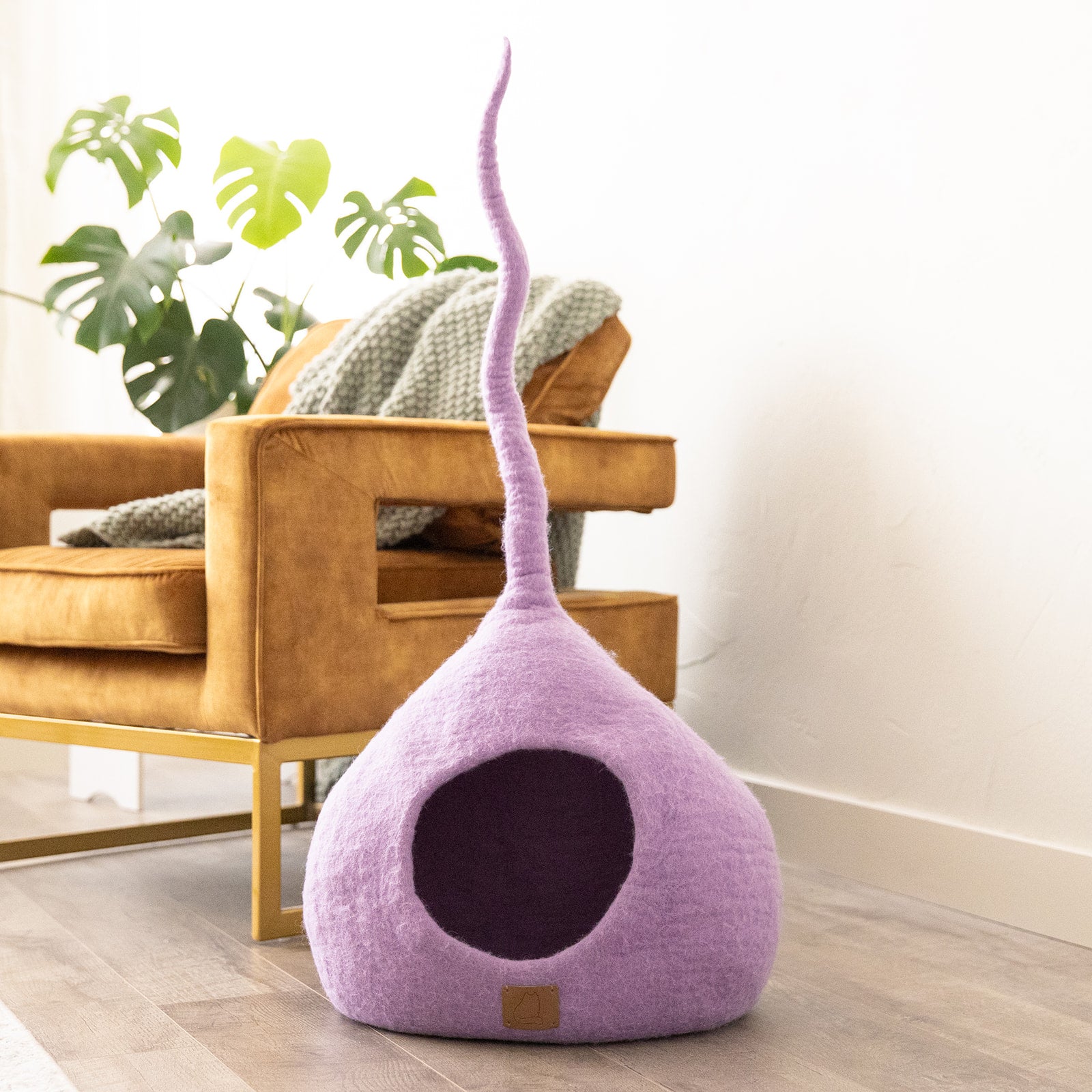 Lilac Purple Tail Style Cave, a cozy and stylish cat bed made from felted wool, featuring a peekaboo entrance and modern design.