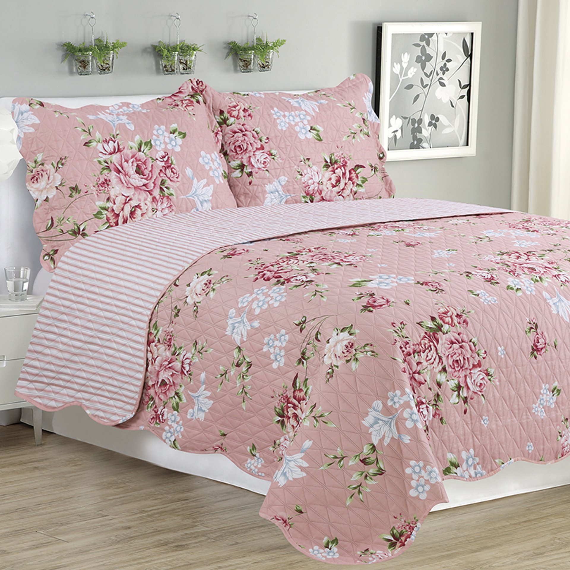 Melissa 3 Piece Quilt Set in warm pink, featuring a cozy quilt and two matching pillow shams, elegantly displayed on a bed.