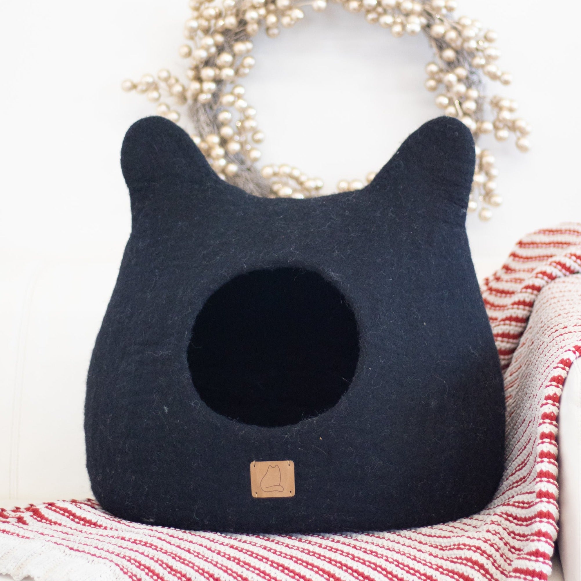 Night Black Ear Style Cave made of luxurious felted wool, featuring a peekaboo design for cats, elegantly styled for modern home decor.