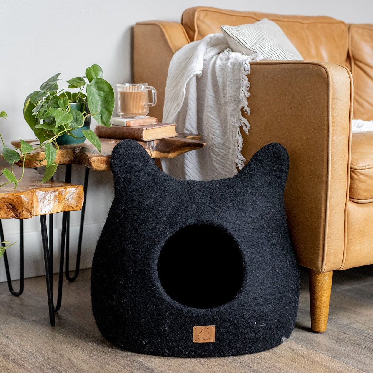 Night Black Ear Style Cave made of luxurious felted wool, featuring a peekaboo design for cats, elegantly styled for modern home decor.