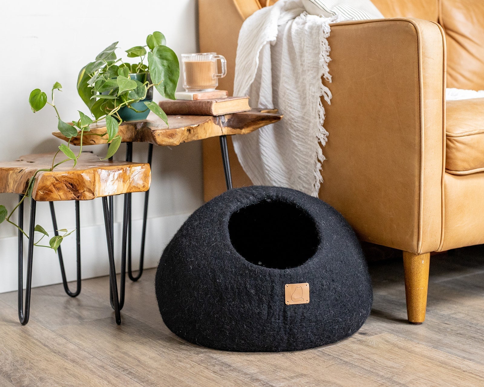 Night Black Round Style Cave, a luxurious felted wool cat bed designed for comfort and style, featuring a peekaboo round design.