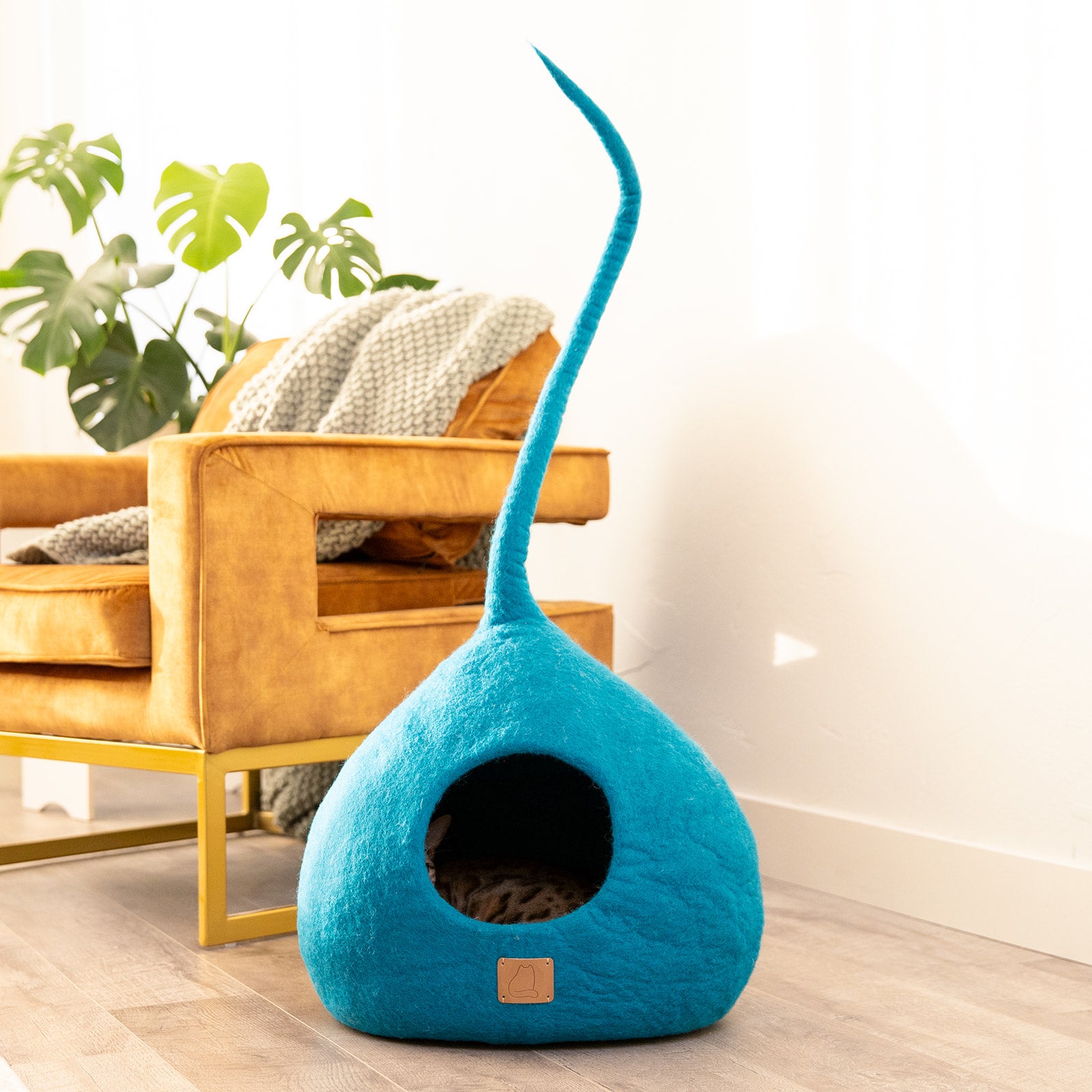 Ocean Blue Tail Style Cave, a handcrafted wool cat cave with a peekaboo entrance, designed for comfort and style.