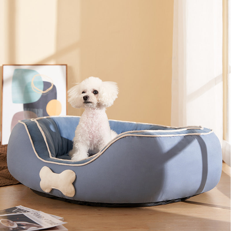 A cozy Pet Cats Bed Soft Sofa in dark blue, designed for winter warmth, featuring a double-sided cotton linen design suitable for cats and small dogs.