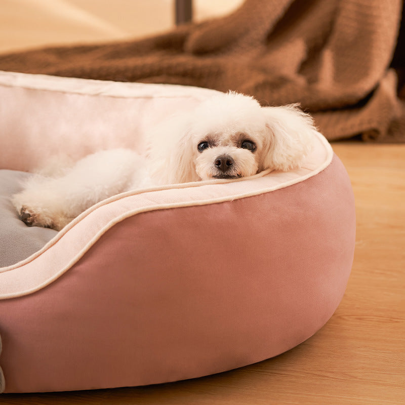 A cozy Pet Cats Bed Soft Sofa in dark blue, designed for winter warmth, featuring a double-sided cotton linen design suitable for cats and small dogs.