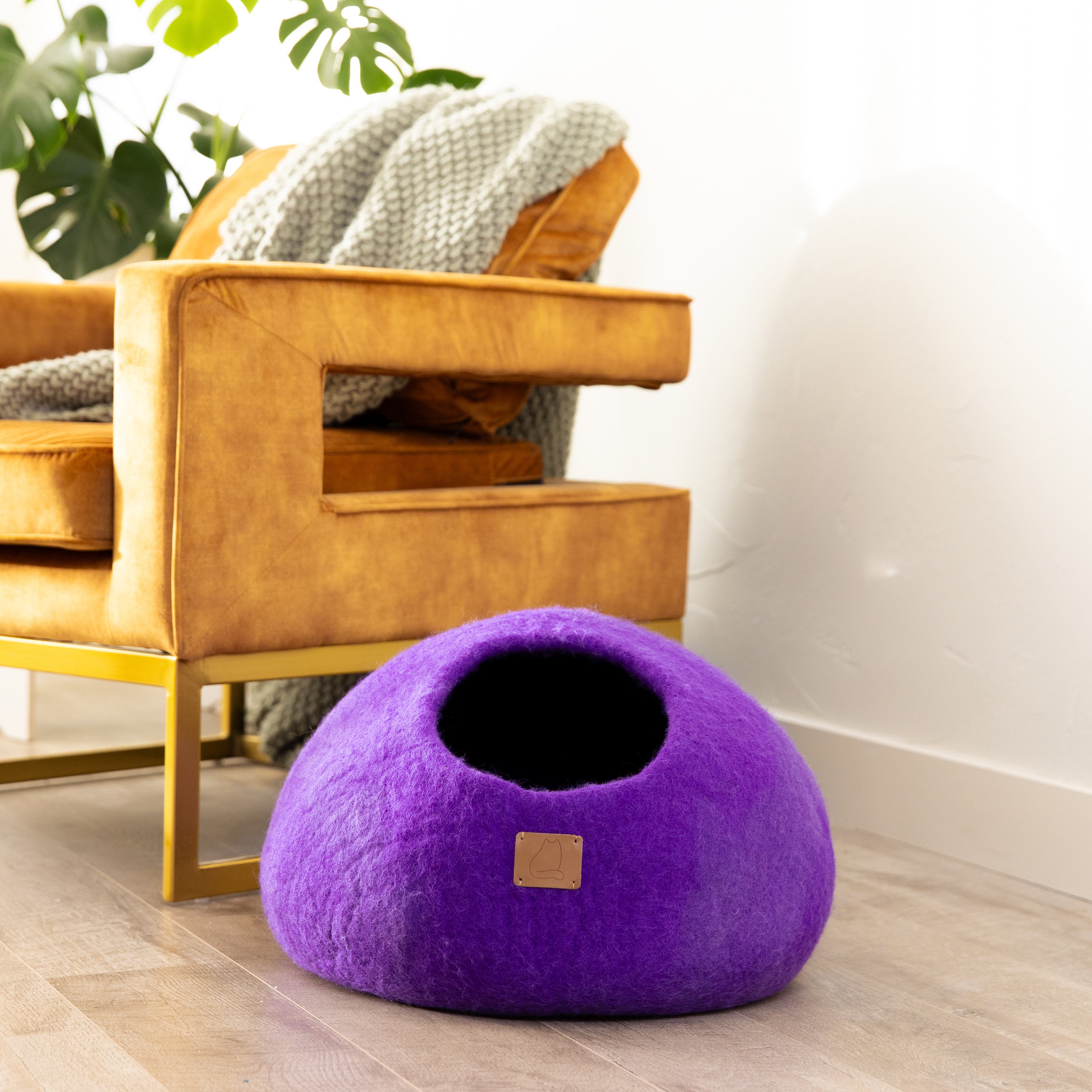 Plum Purple round style cat cave bed made of luxurious felted wool, designed for comfort and style, perfect for cats of all sizes.