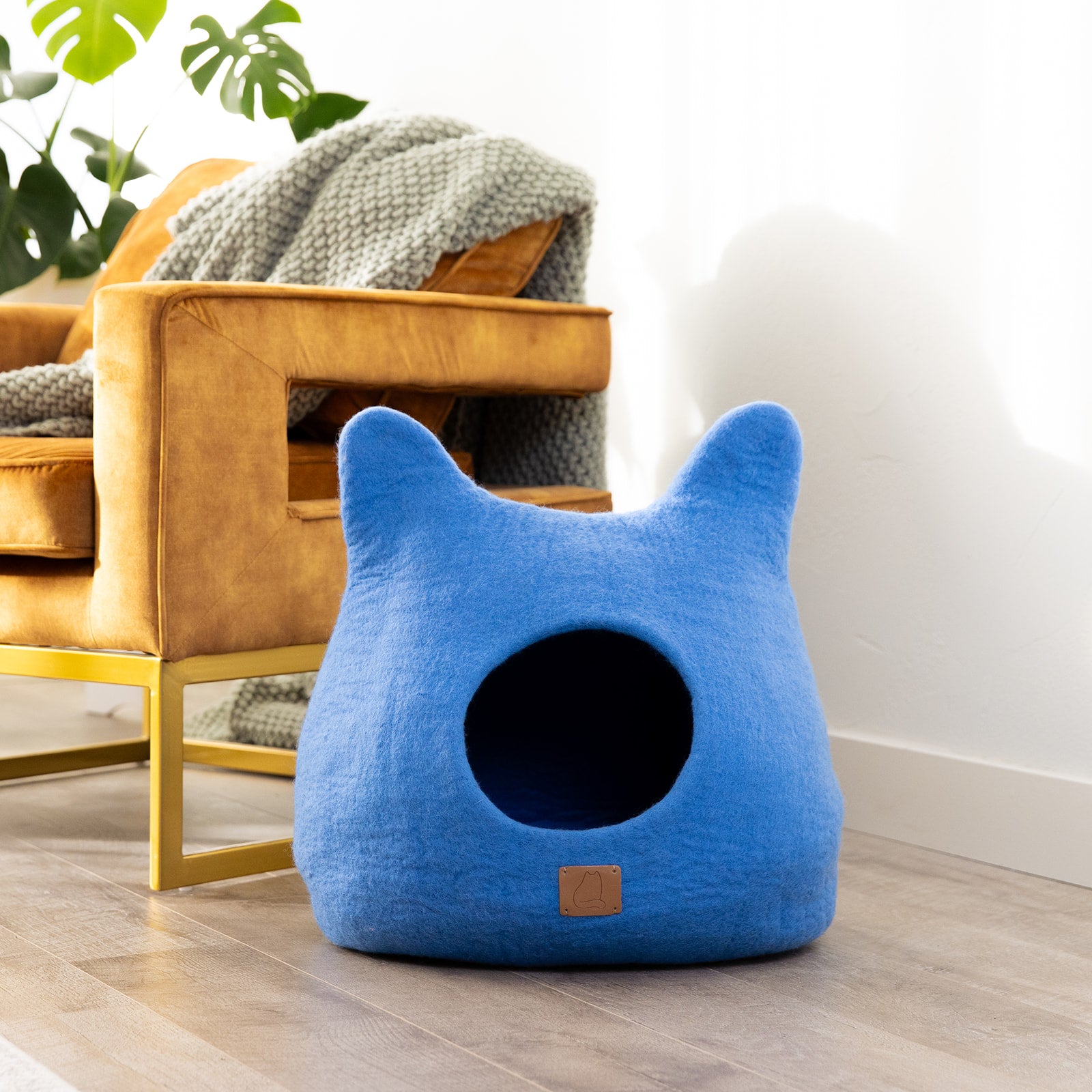 Sky Blue Ear Style Cave made of luxurious felted wool, featuring a cozy design perfect for cats of all sizes.